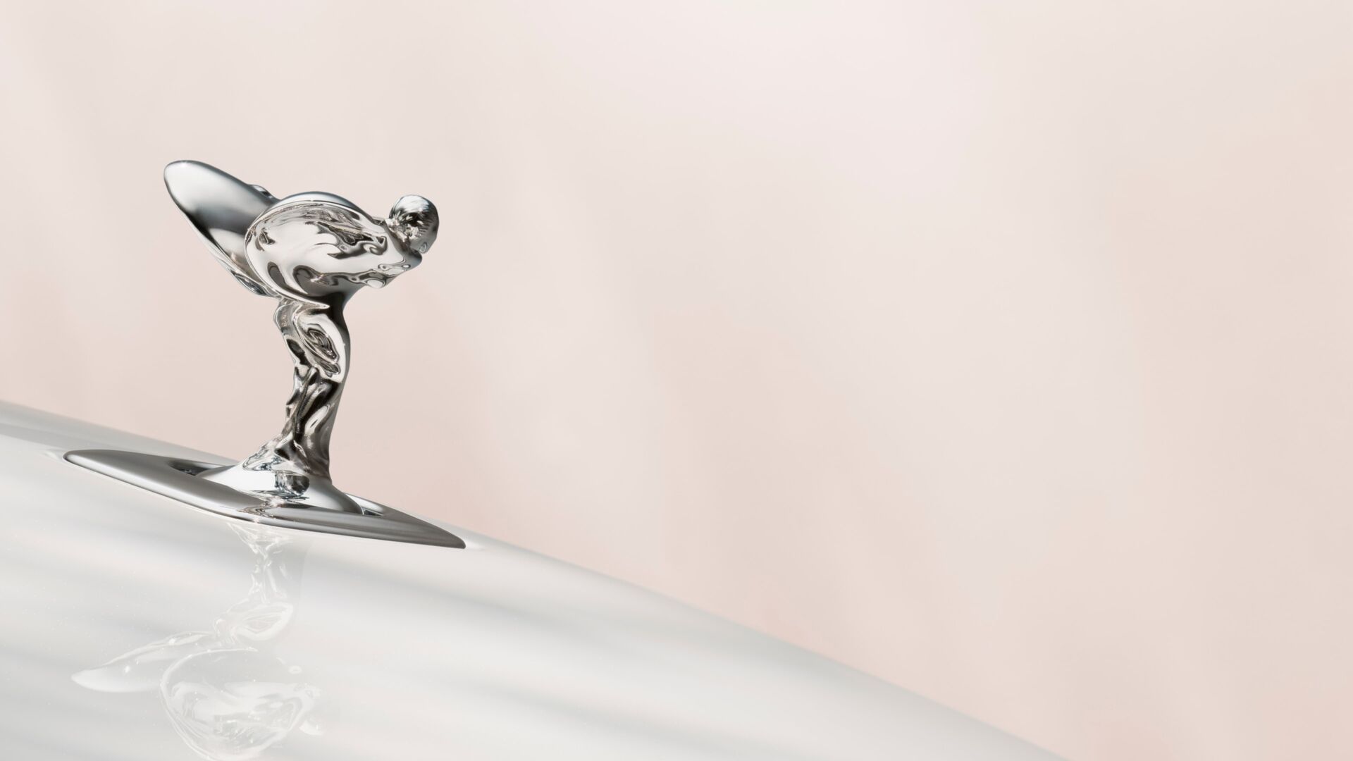 Close up of the Spirit of Ecstasy sitting on top of the Spectre bonnet.