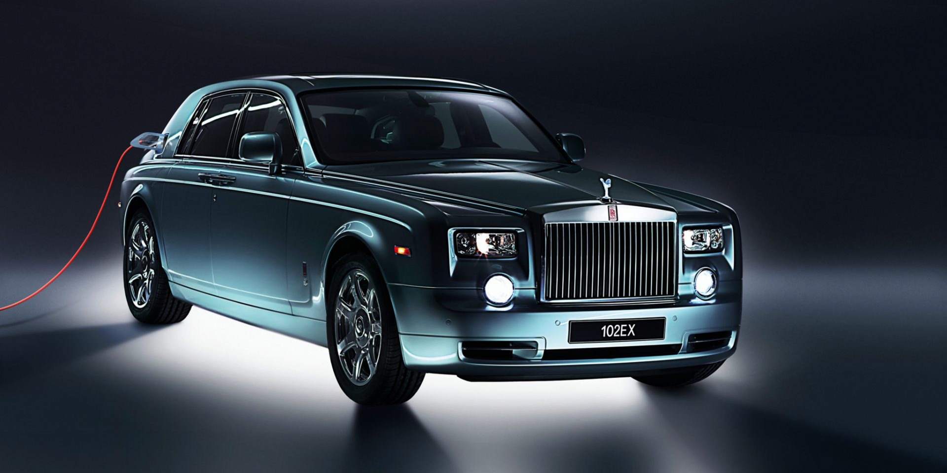 A light blue electric prototype of a Rolls-Royce motor car.