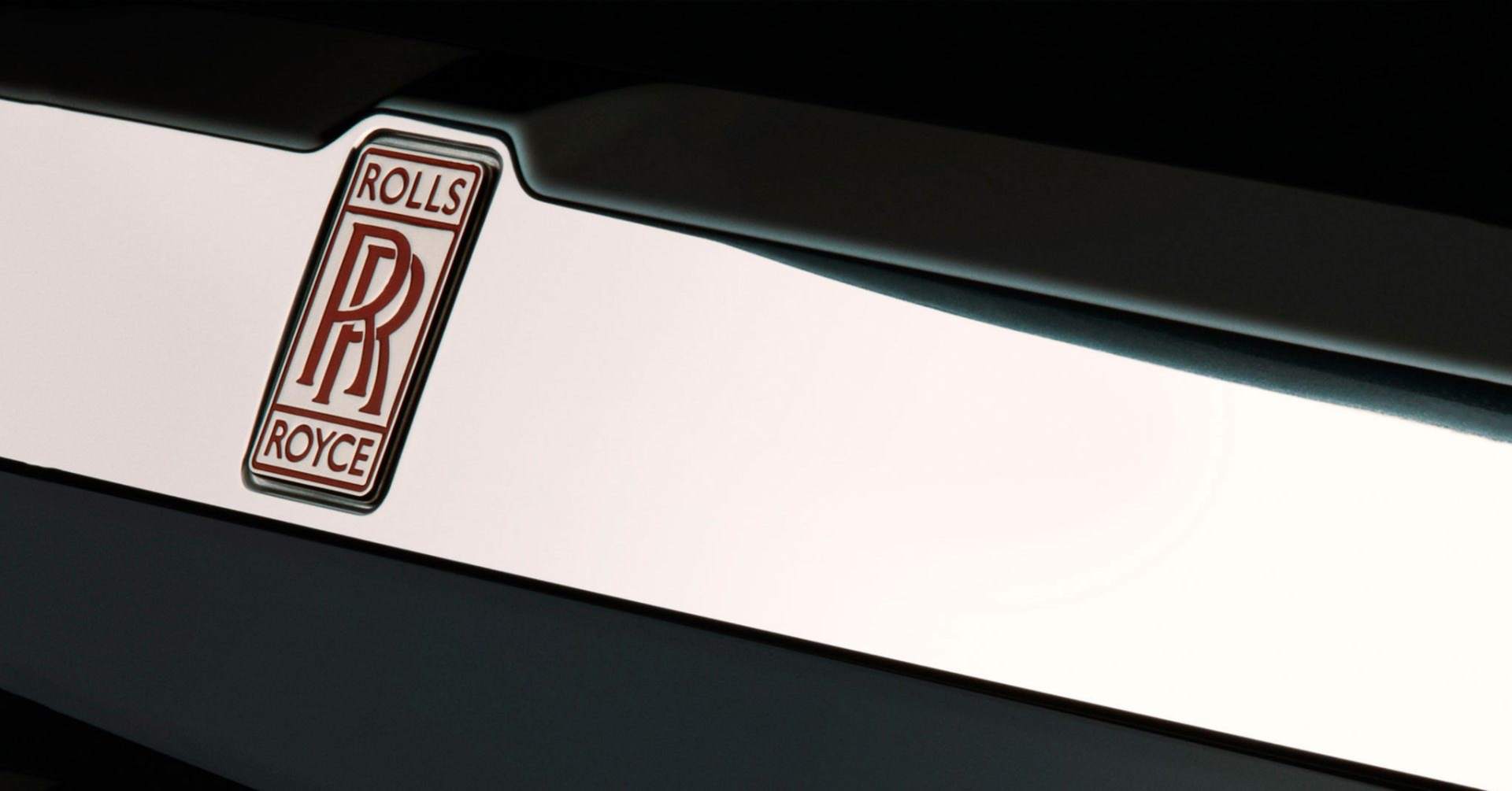 Close-up of the Rolls-Royce Motor Cars logo featured on a prototype electric vehicle.