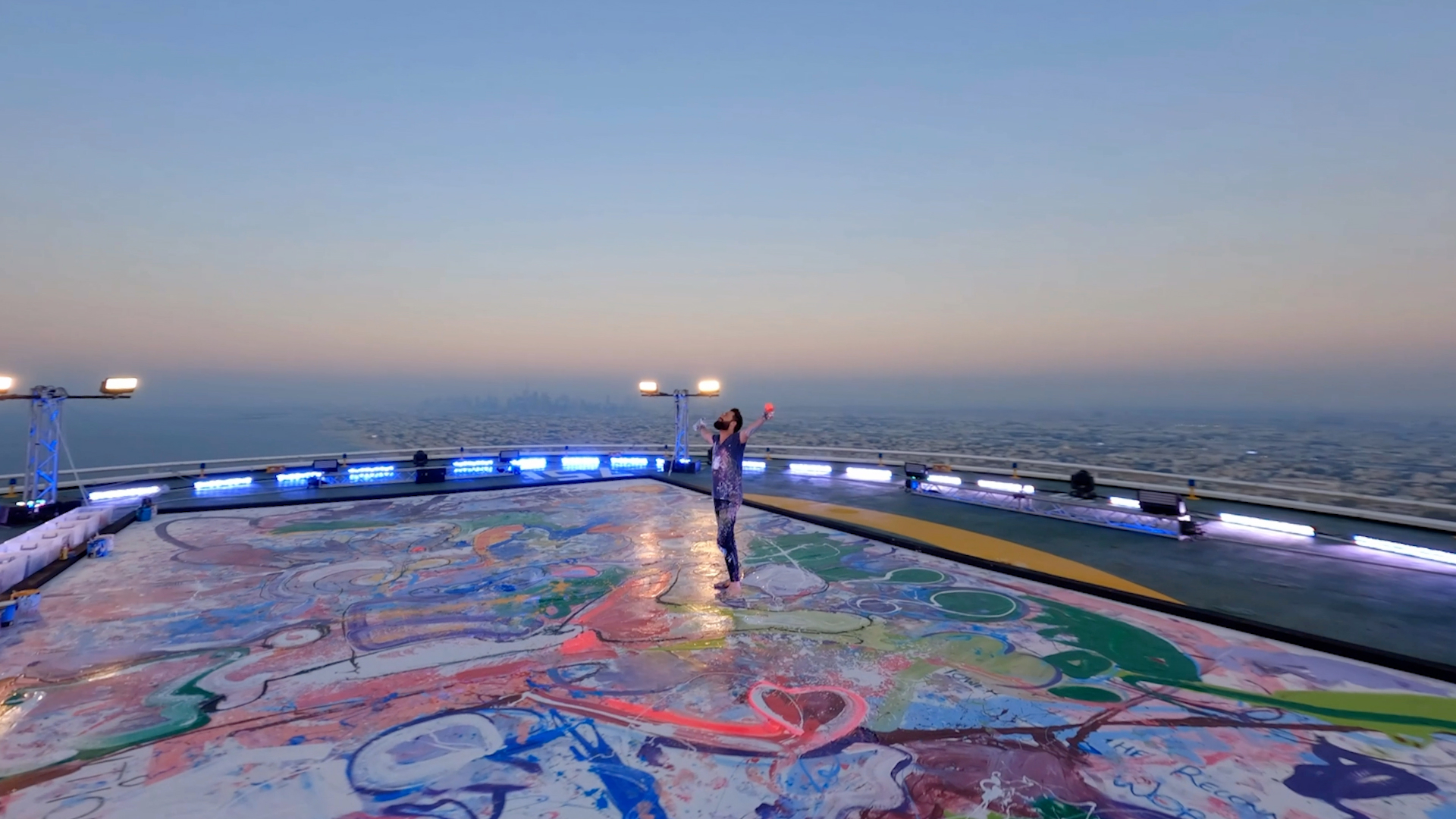 Sacha Jafri over one of his art pieces