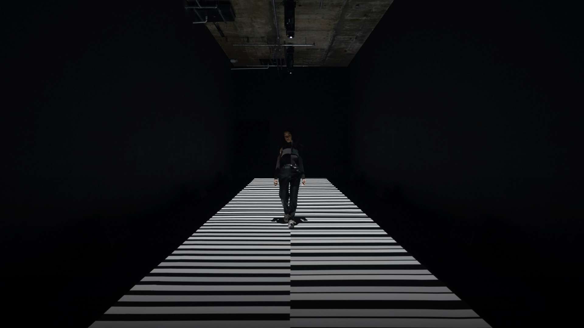 Person stands within artwork by Japanese visual artist Ryoji Ikeda