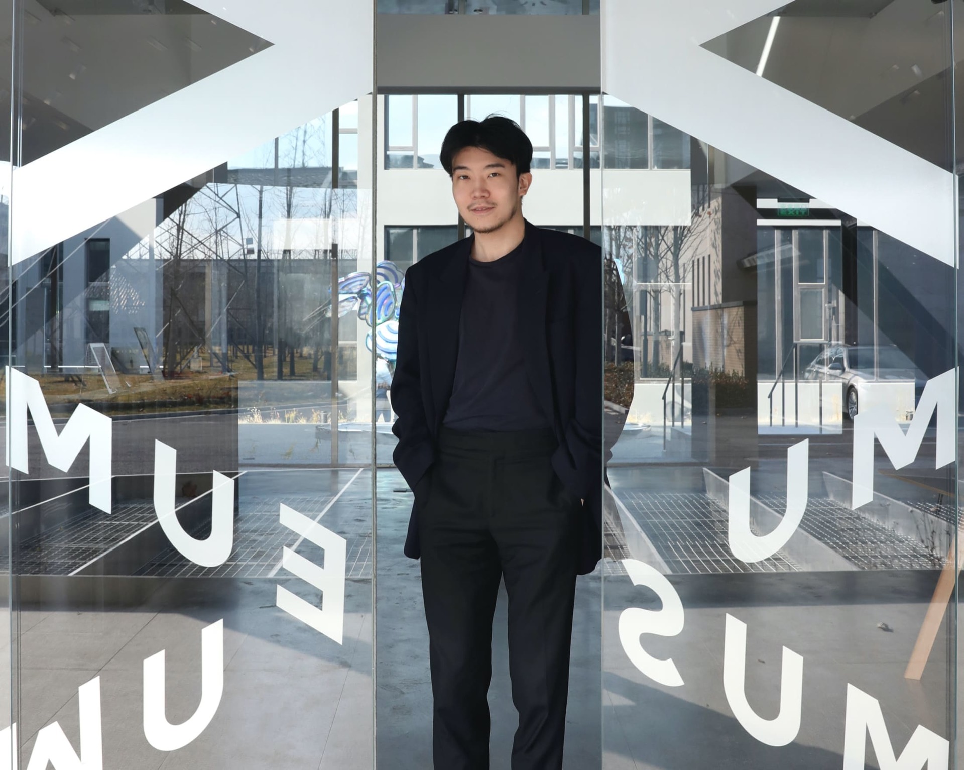 Michael Xufu in front of the museum entrance