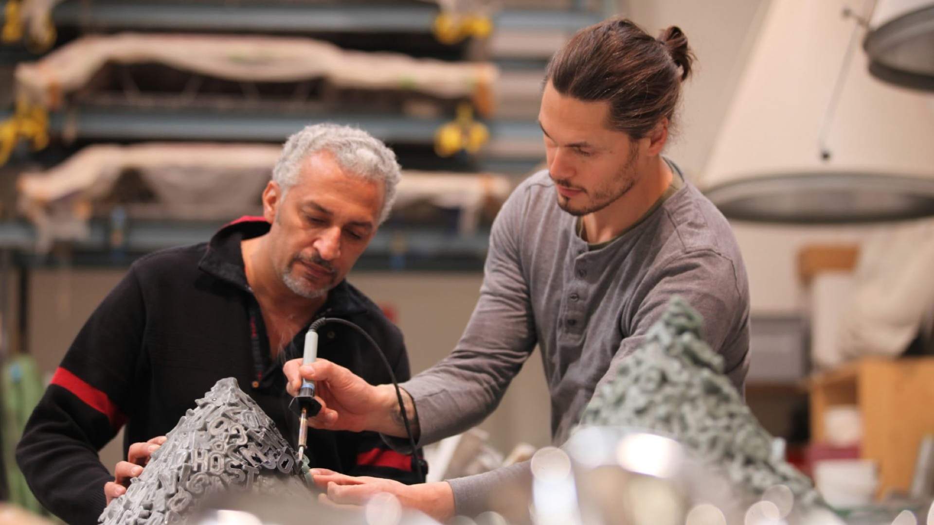 Mohammed Kazem and some of Rolls-Royce's talented craftspeople working and sharing creative thoughts