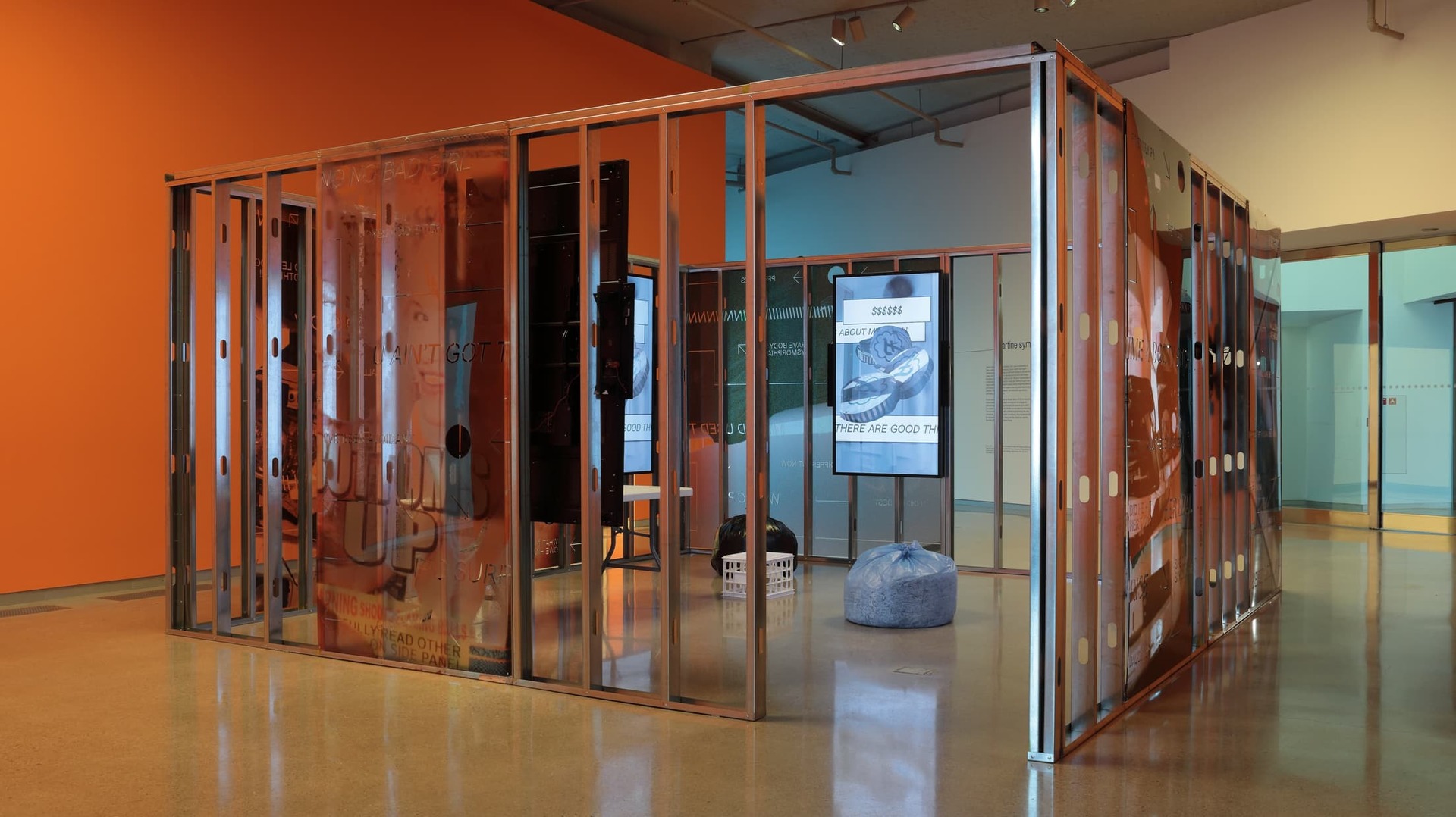 A shot showing the 'Shame Space' piece - shows the exterior of the art installation, in which you can see some of the pieces making up the installation