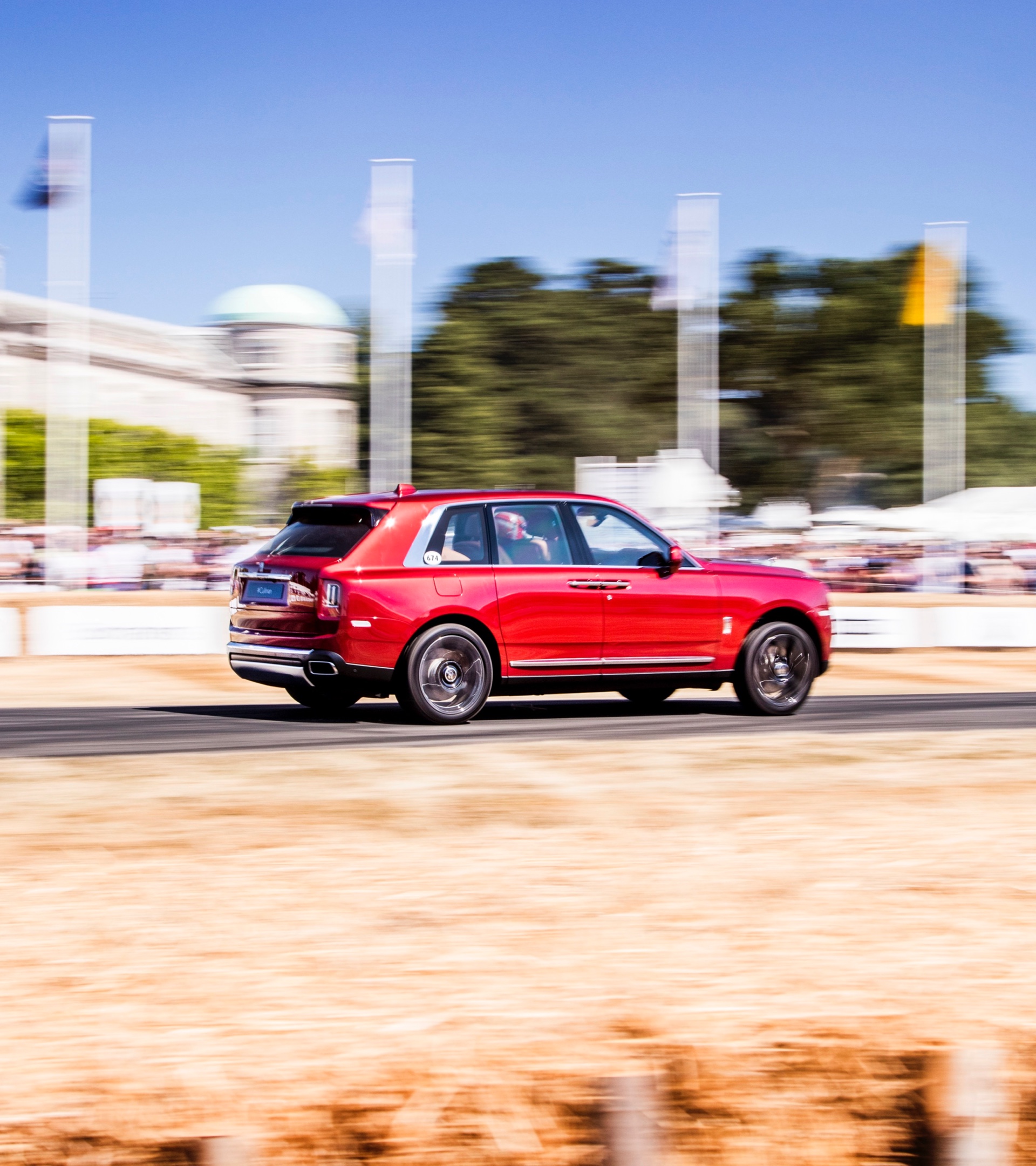 Red Cullinan Racing on a Sunny day 