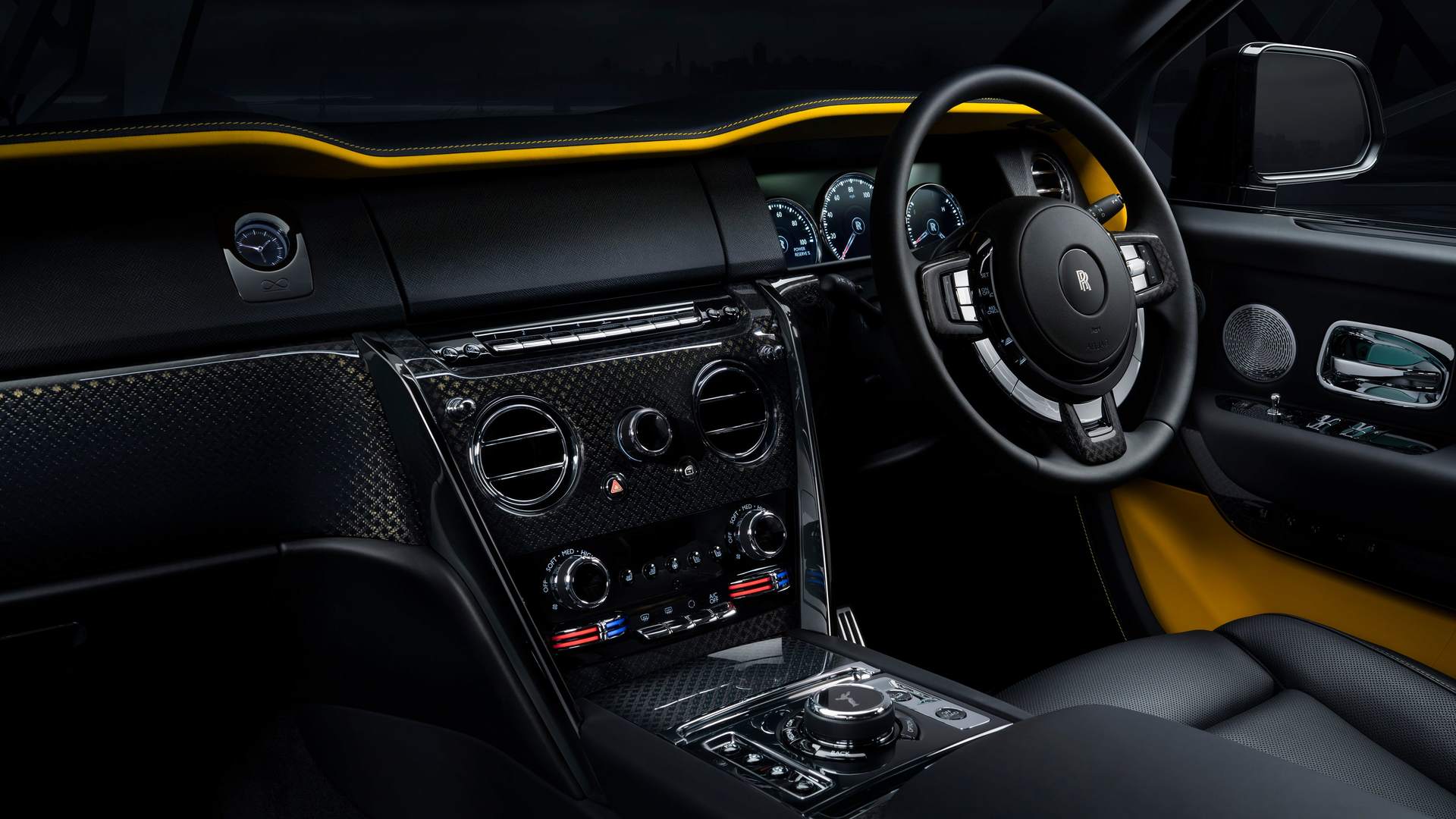 Interior of the Rolls-Royce Black Badge Cullinan motor car with Forge Yellow accents and details