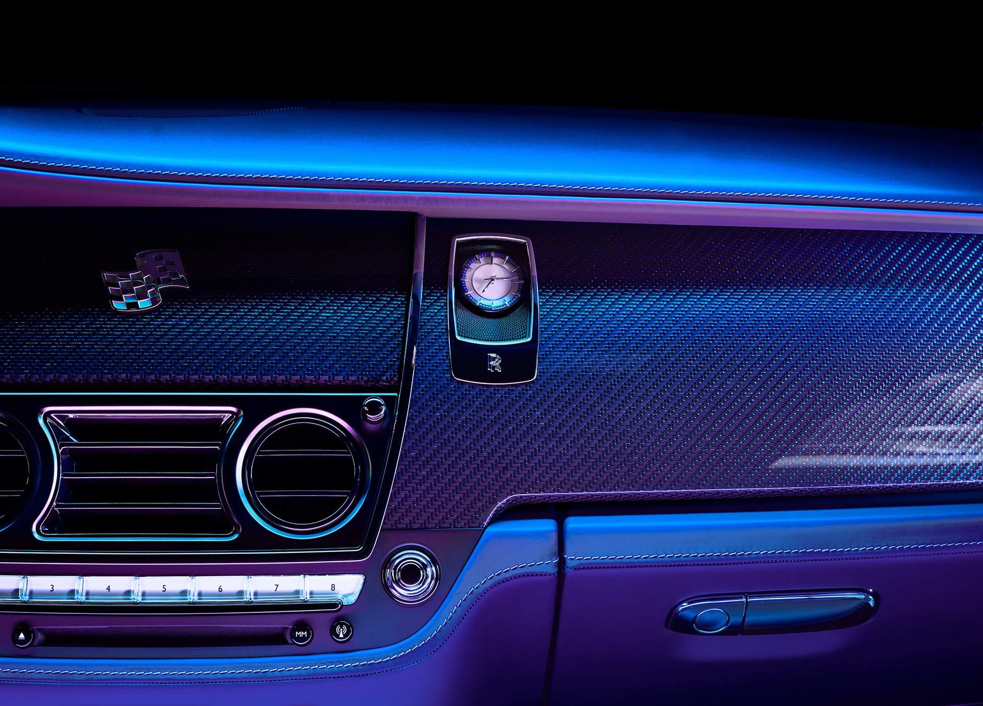 Interior dashboard detail of Technical Weave, Rolls-Royce Bespoke's sparkling interpretation of carbon fibre, accented with tinted strands of aluminium thread