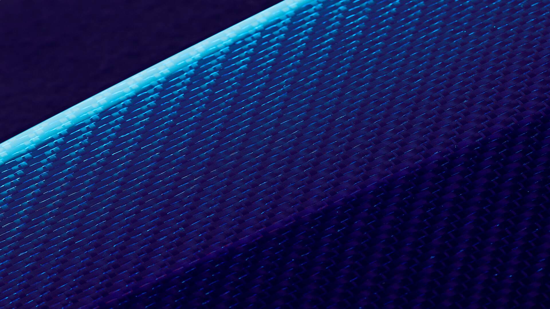Close-up detail of Technical Weave, Rolls-Royce Bespoke's sparkling interpretation of carbon fibre, accented with tinted strands of aluminium thread