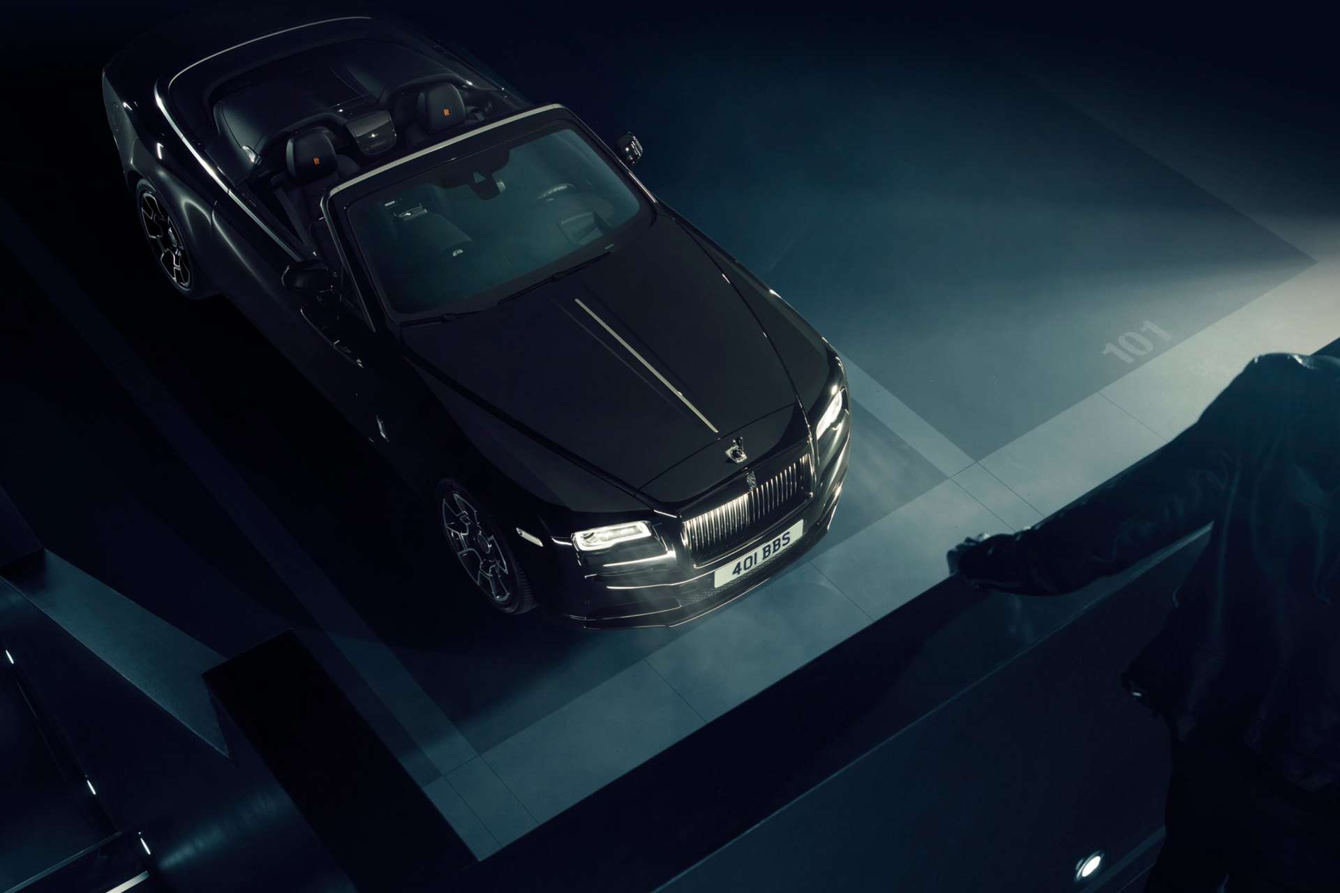 A top down view of a Rolls-Royce Black Badge Dawn motor car.