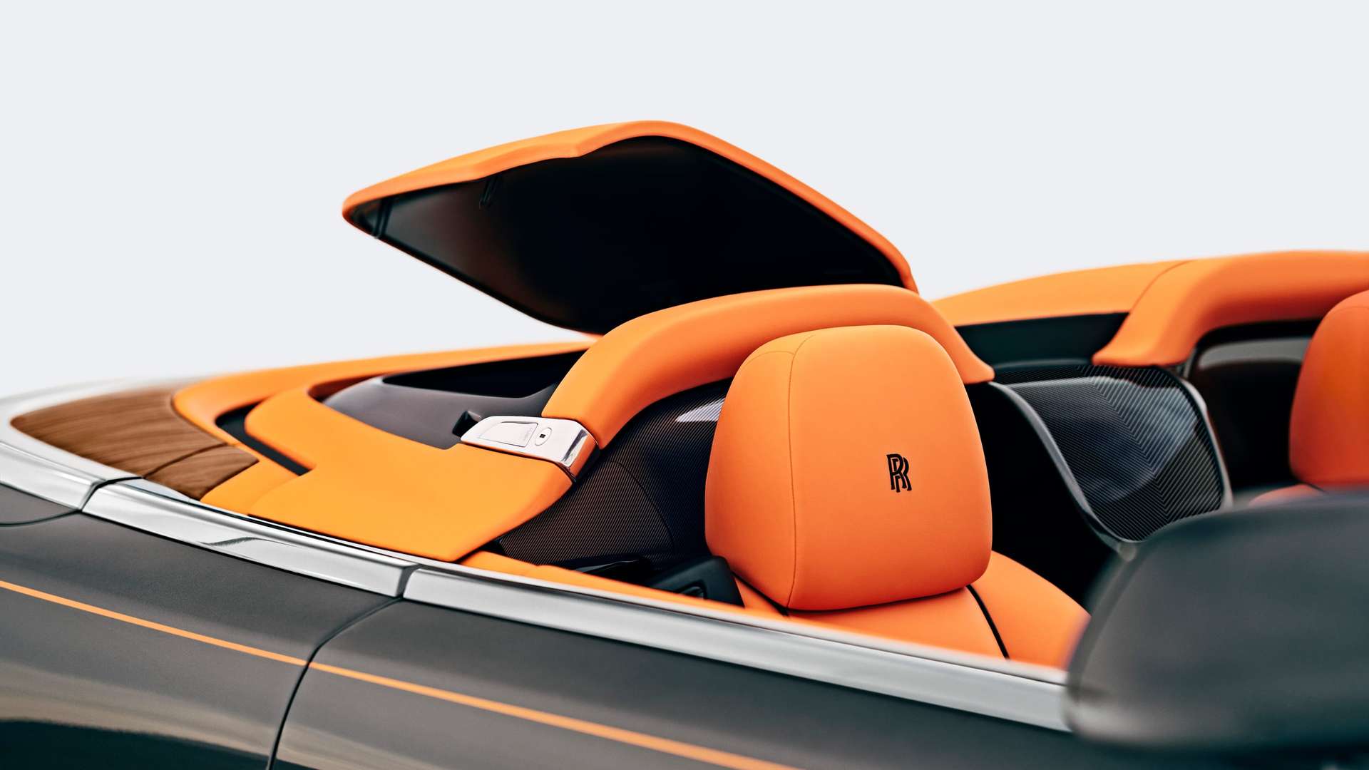 A close up of the orange leather interior on a convertible Rolls-Royce Dawn