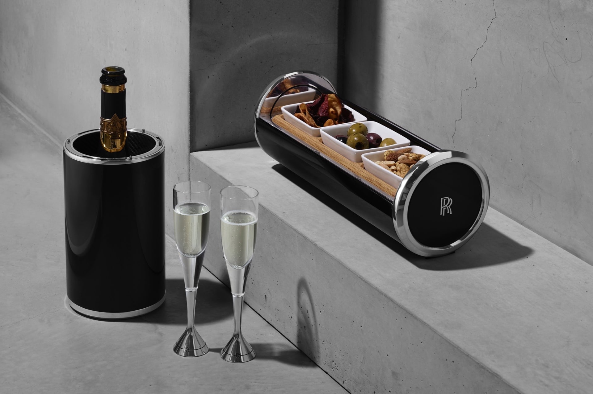 A bespoke thermal champagne cooler and a canapé capsule neighboured by the hand-blown crystal aluminium flutes