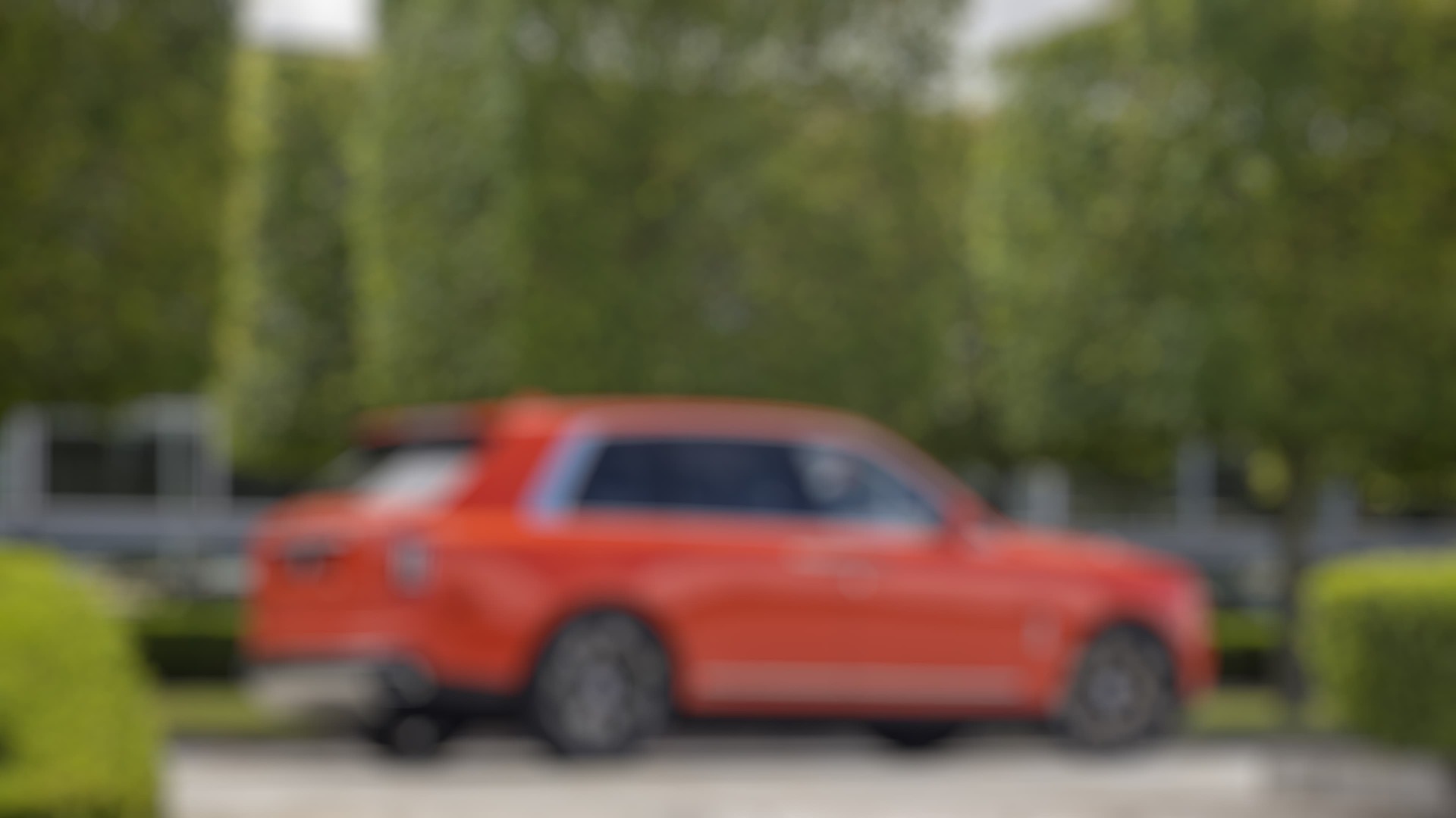 Side exterior view of the Rolls-Royce Cullinan motor car stationary in the Goodwood grounds