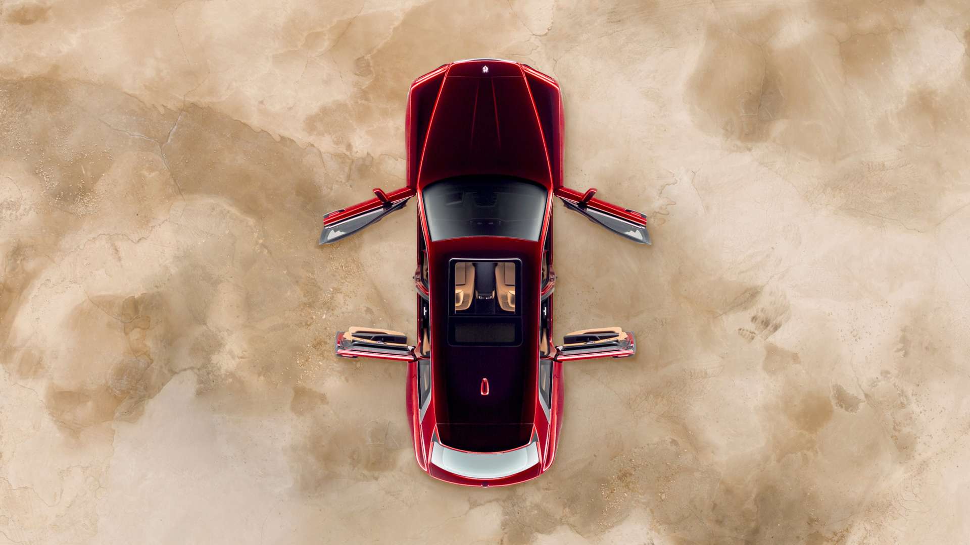 A top down view of a red Rolls-Royce Cullinan motor car