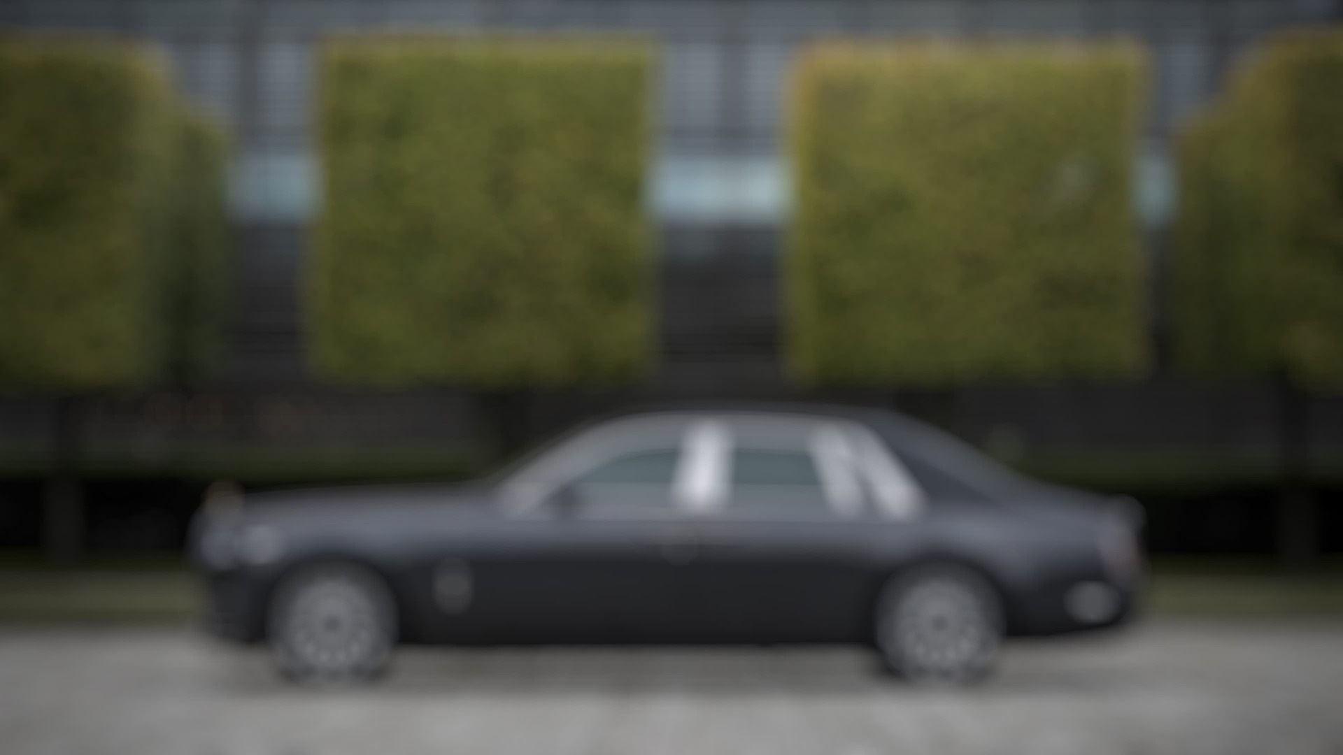 Side exterior view of a stationary Rolls-Royce Phantom EWB motor car in the Goodwood grounds