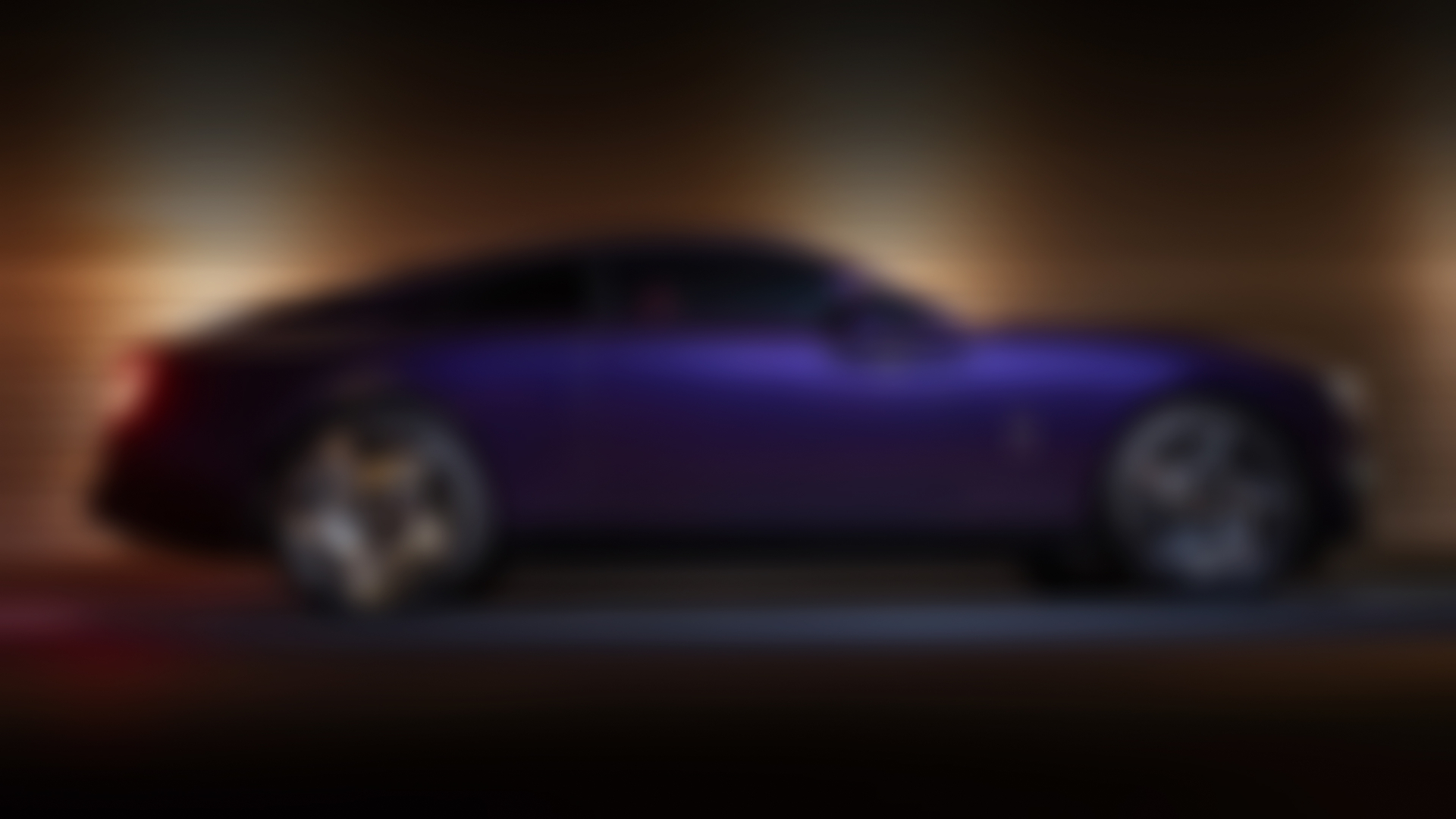 Purple Black Badge Spectre ascending up the road, showcasing the beautiful Spectre rims. 