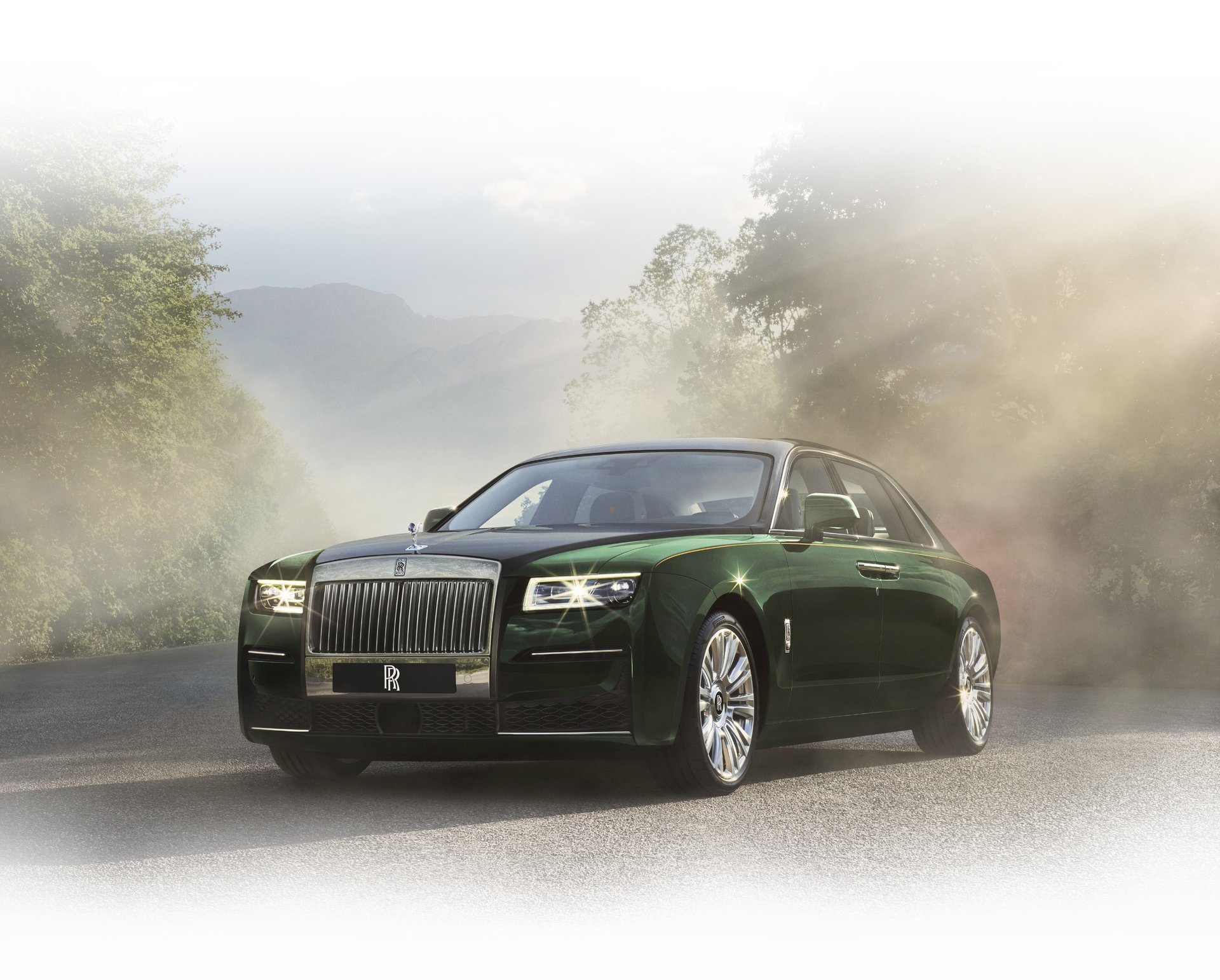 3/4 front image of Rolls-Royce Ghost Extended motor car stationary on road in misty setting