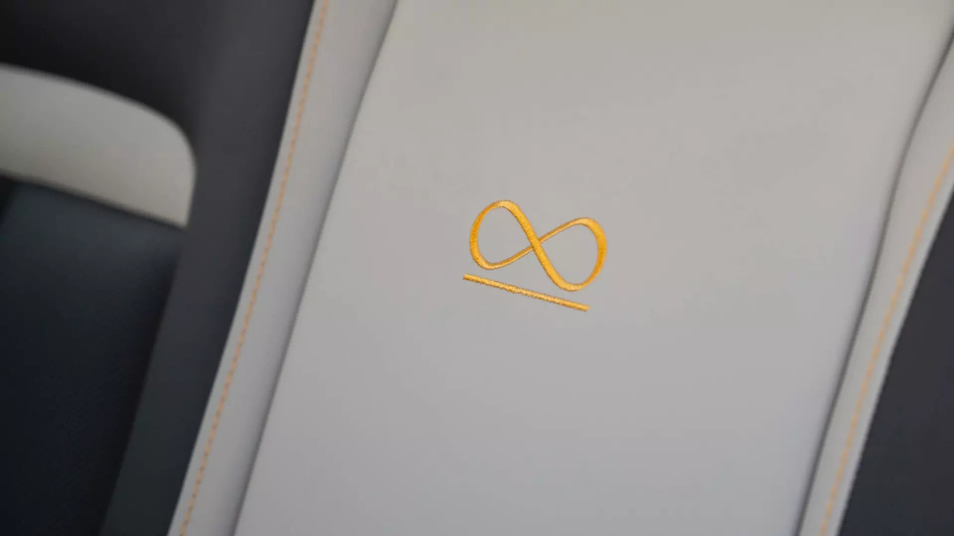 Black Badge Infinity Loop signature symbol detailing in the bespoke Rolls-Royce Black Badge Cullinan Capella motor car