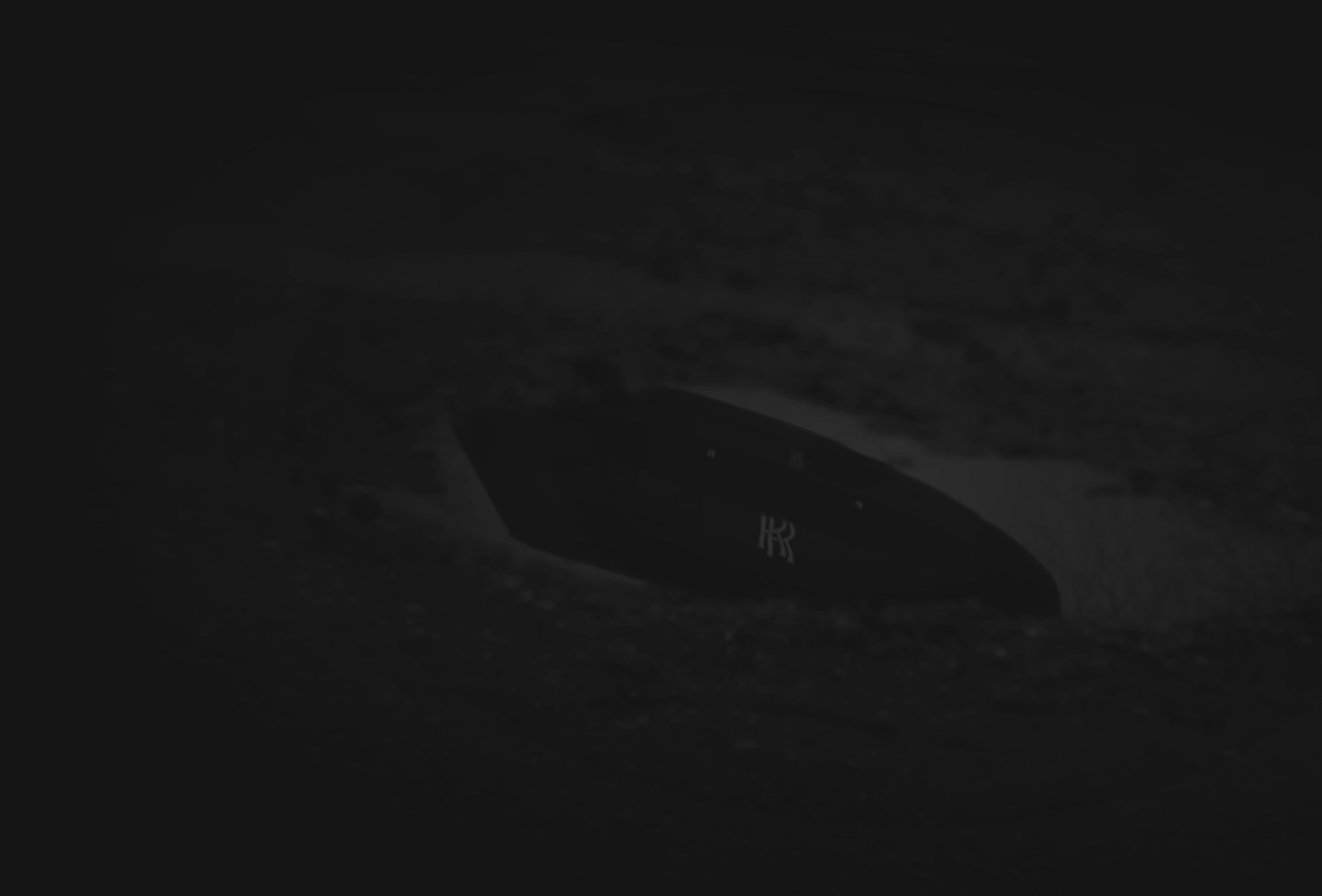 Darkened image of bespoke Rolls-Royce monogram