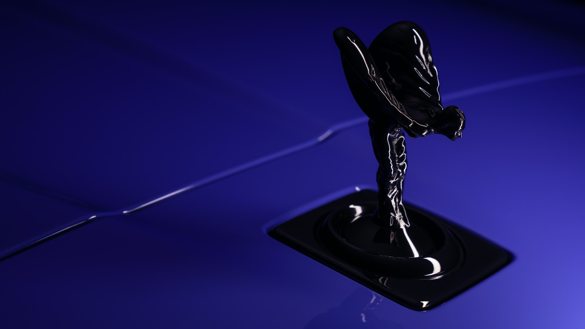 Close-up view of the front of a Mirabeau Blue Black Badge Cullinan with a Spirit of Ecstasy.