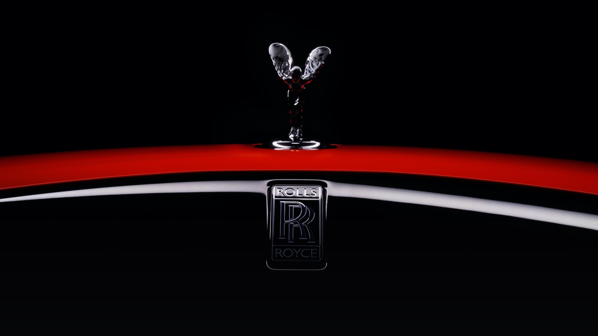 Close-up view of the front of an Eagle Rock RedBlack Badge Dawn with a Spirit of Ecstasy.