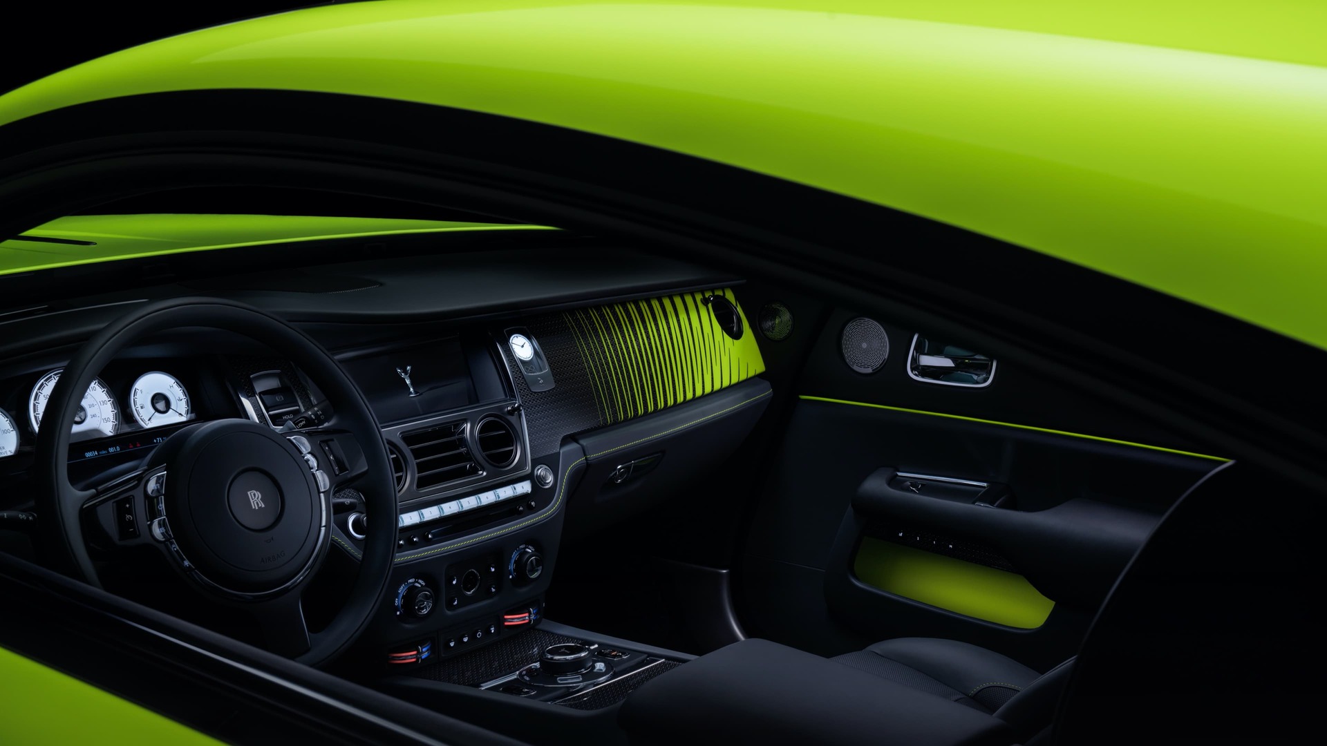 Interior view of a Rolls-Royce Wraith in lime rock green colour.