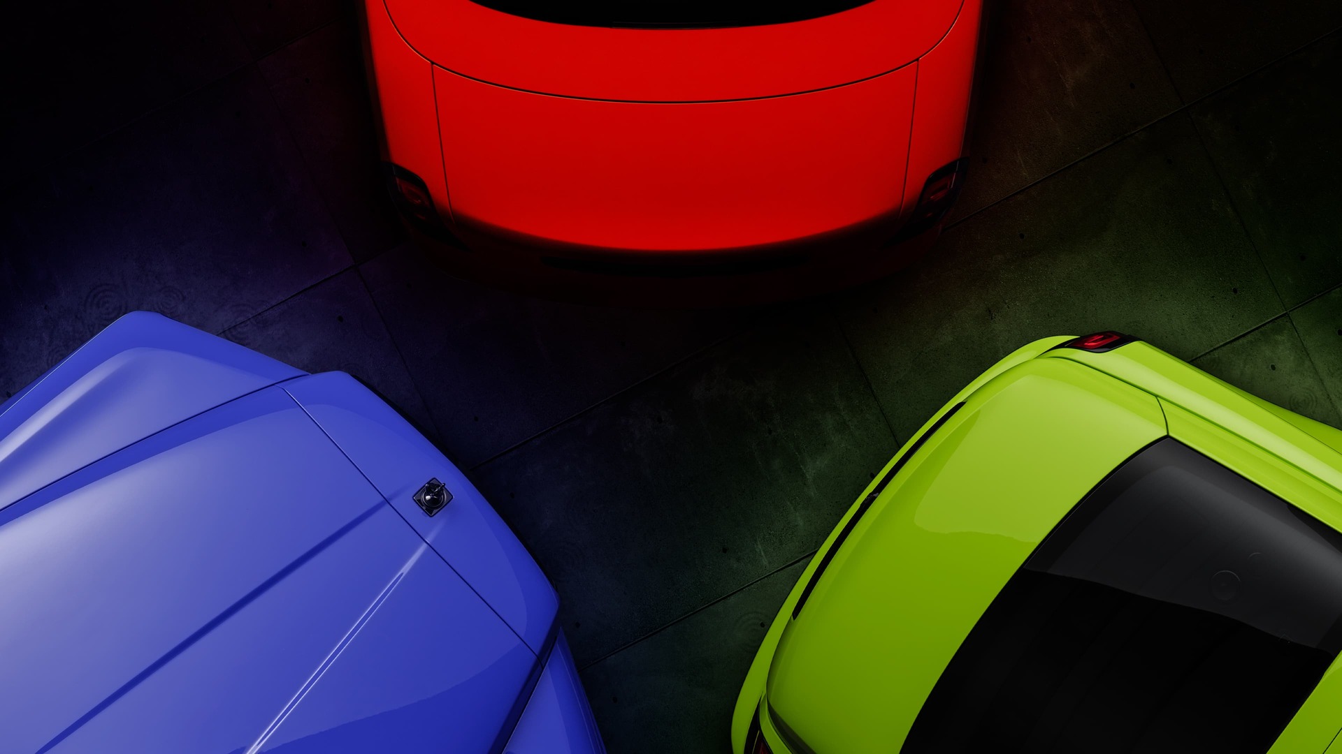 A trio of Rolls-Royce Motor cars from the Black Badge Neon Nights collection in Mirabeau Blue, Lime Rock Green and Eagle Rock Red