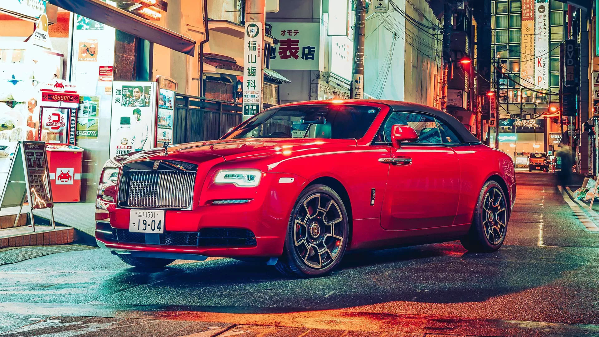 Side profile of Red Rolls Royce Wraith 