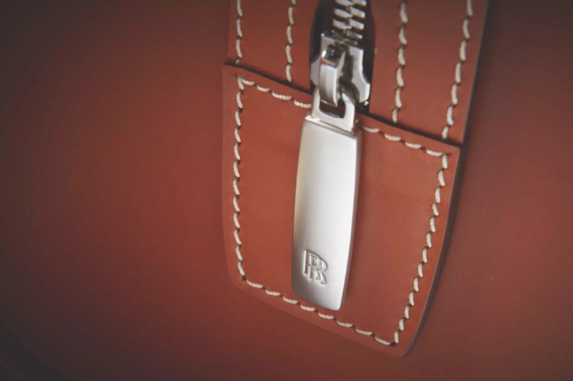 image of zip and stitch details on rolls-royce luggage