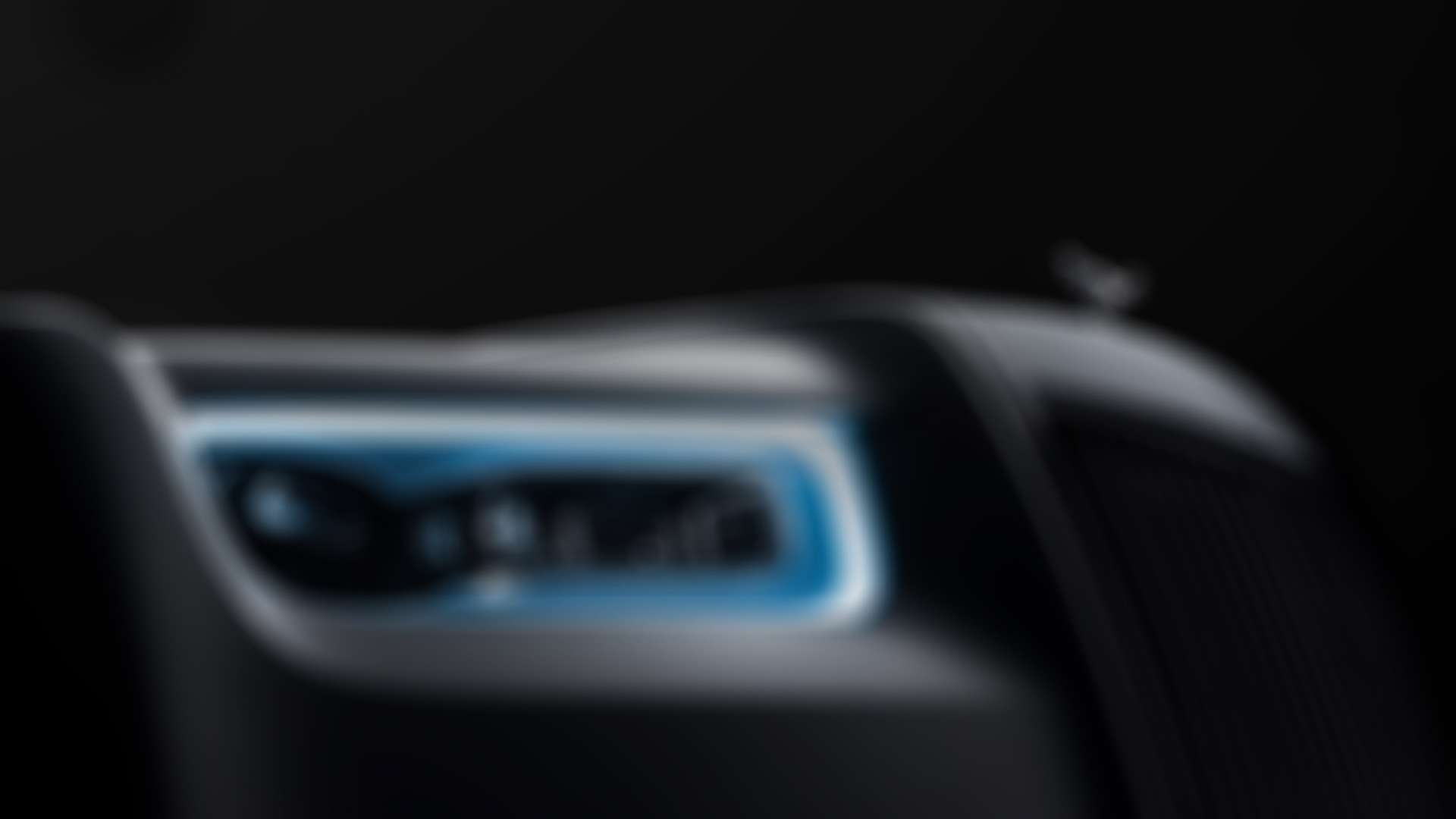 Close up exterior of a Rolls-Royce Phantom headlight.