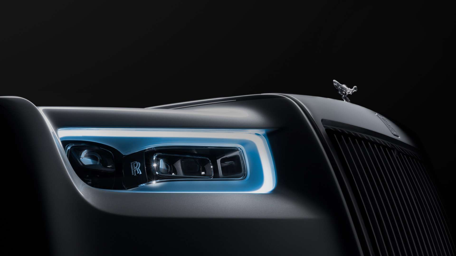 Close up exterior of a Rolls-Royce Phantom headlight.