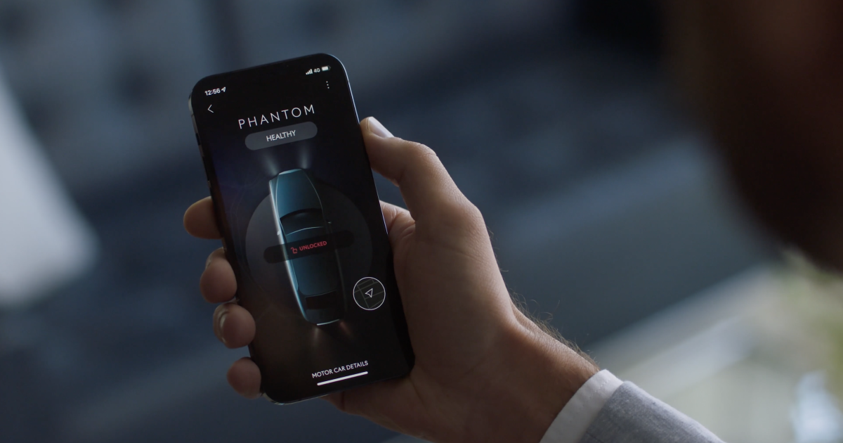 A customer checking the status of its Rolls-Royce Phantom on its phone