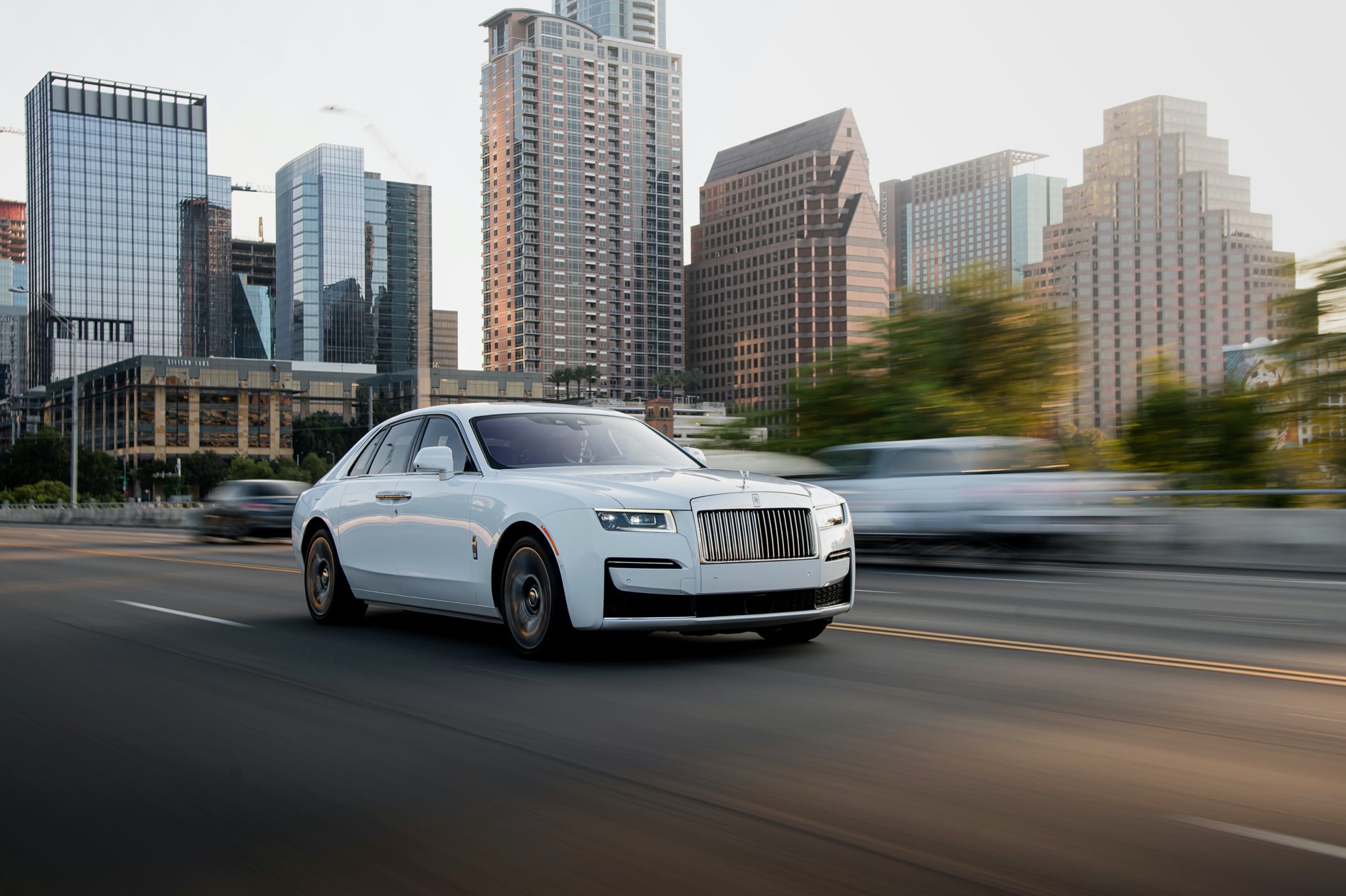 A Rolls-Royce Ghost on the road across the city