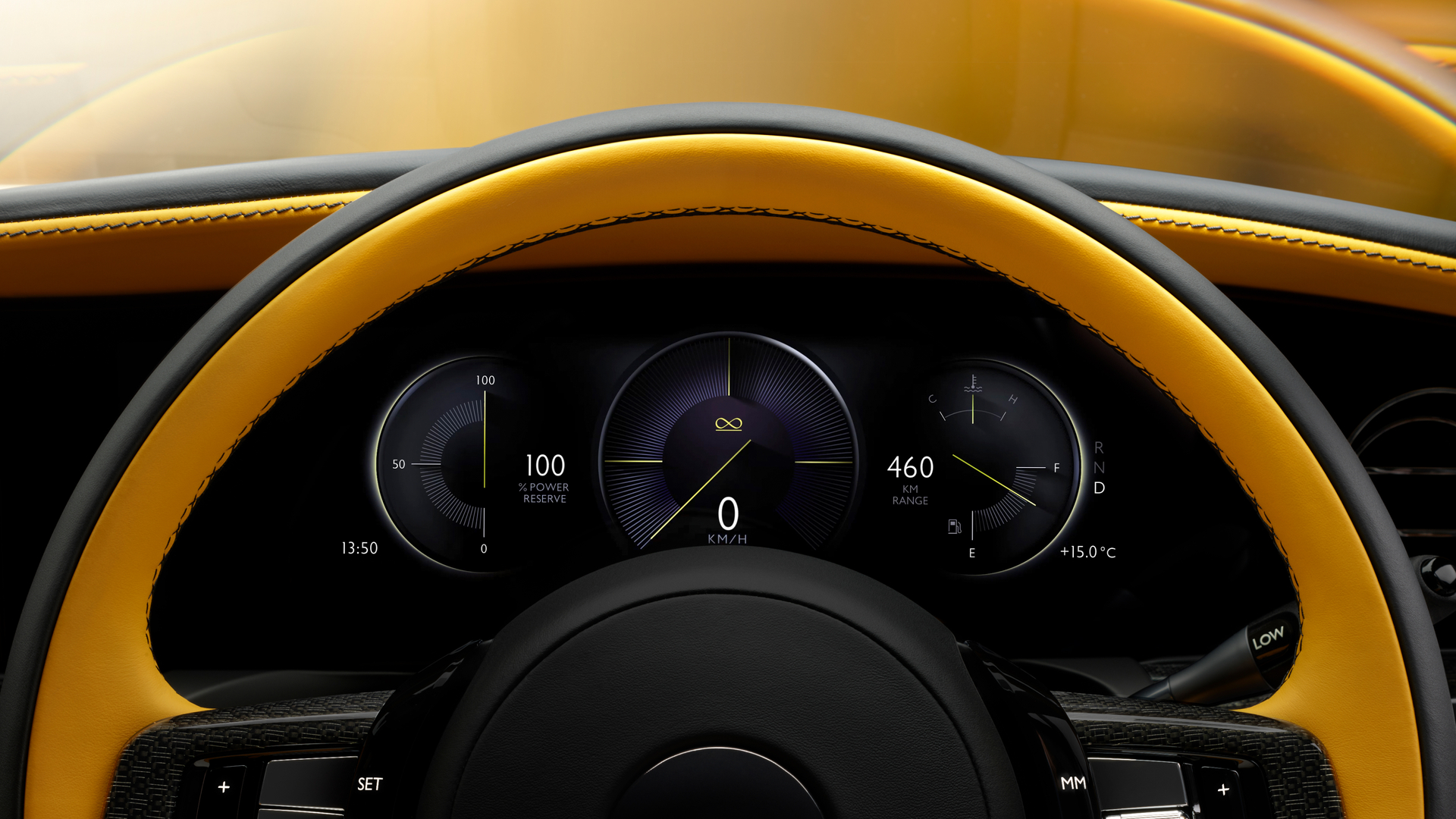Yellow Black Badge wheel showing the speedometer and front navigation.