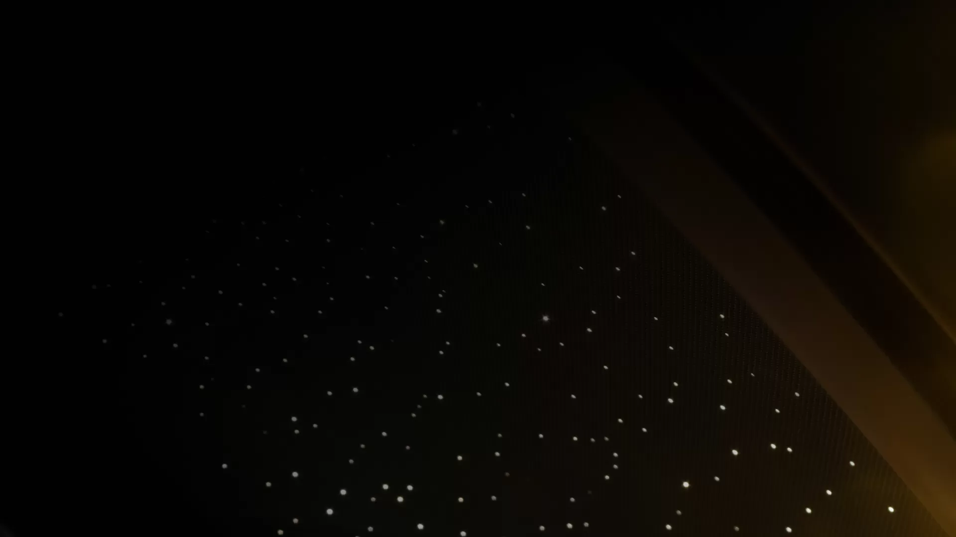 Black background with white Rolls Royce lights.