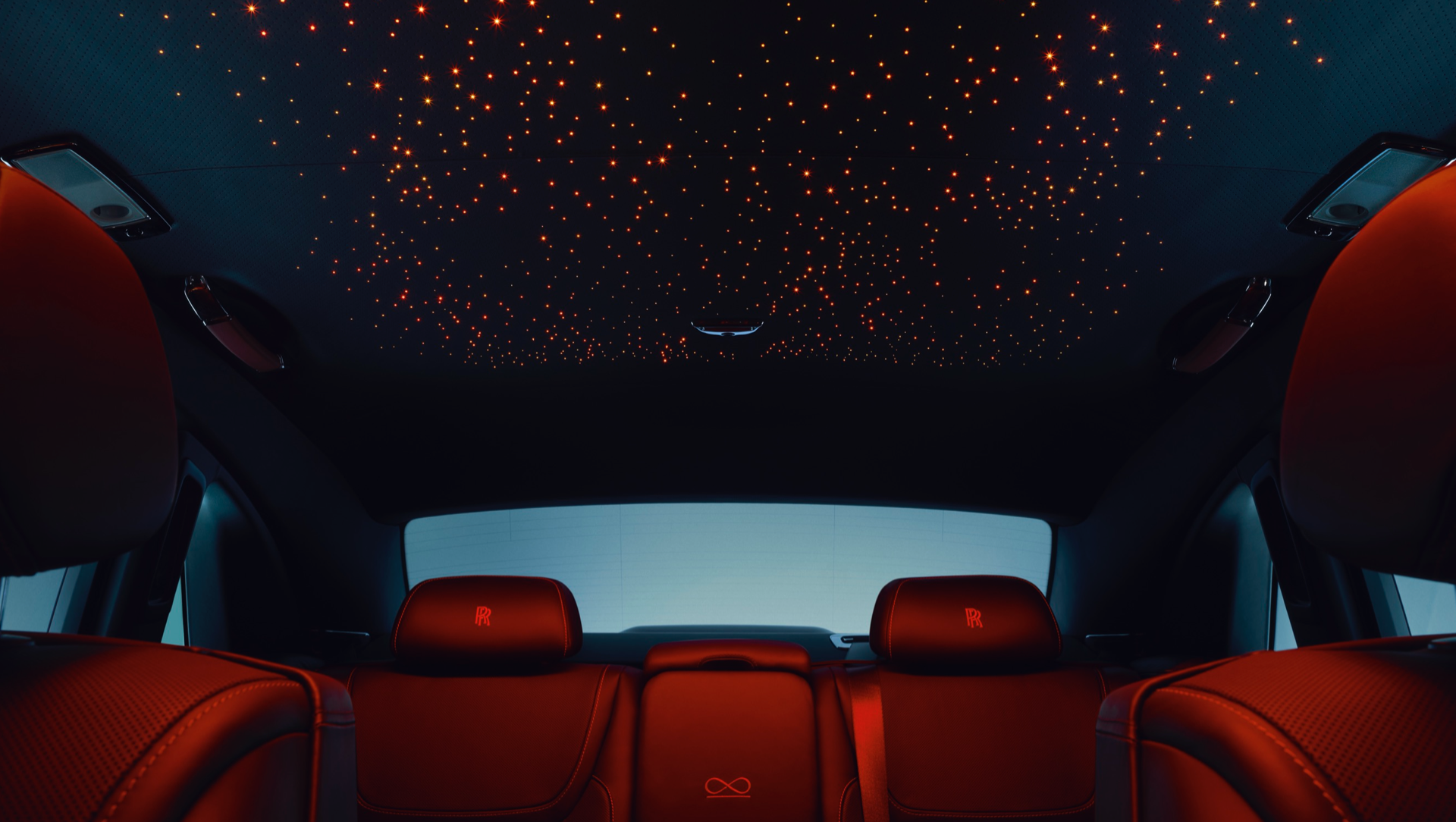 Interior view of the back lounge seats and starlight headliner red lights 