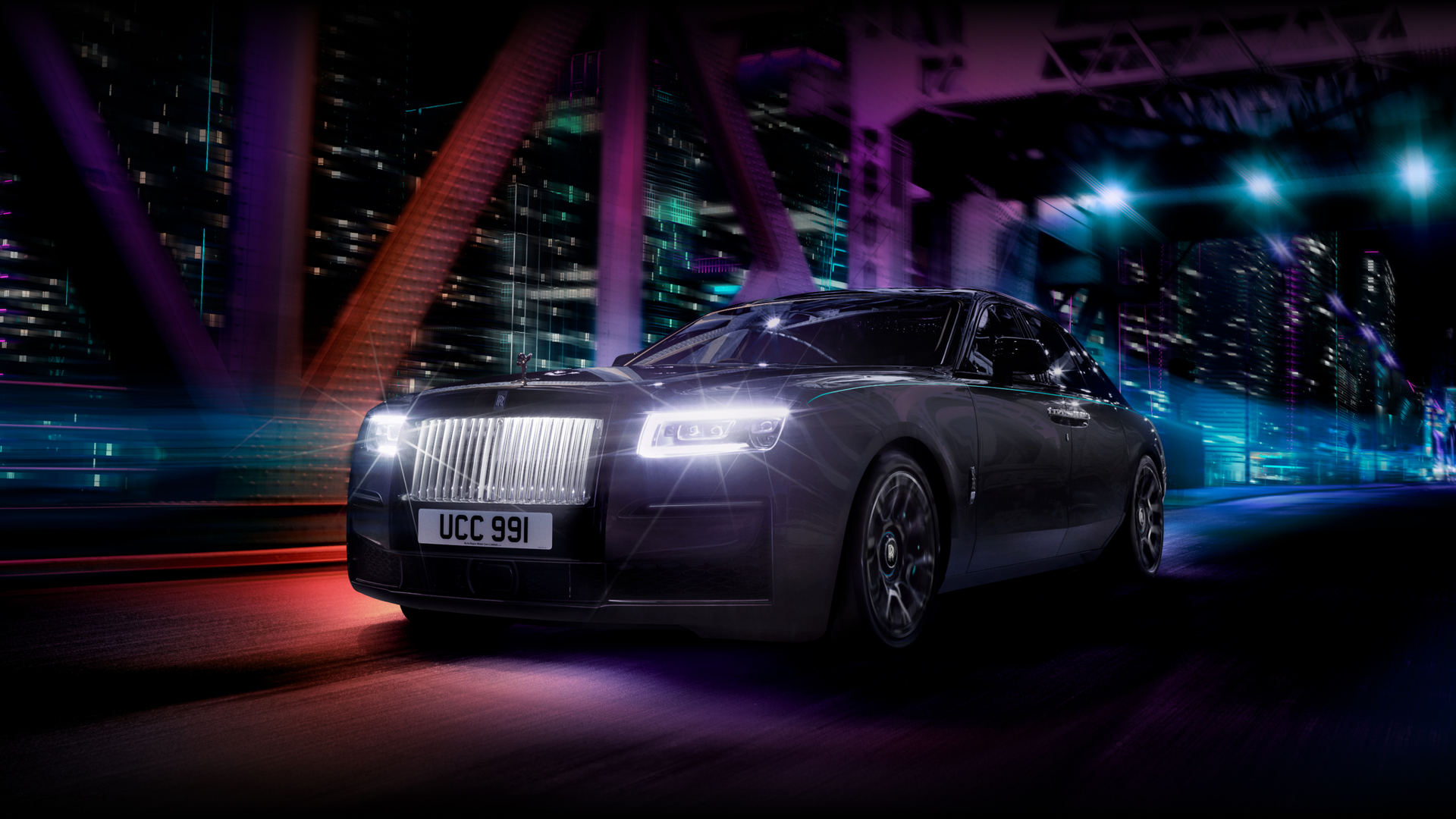 2023 rolls royce ghost images Black Badge Ghost driven on a bridge with full beam headlights