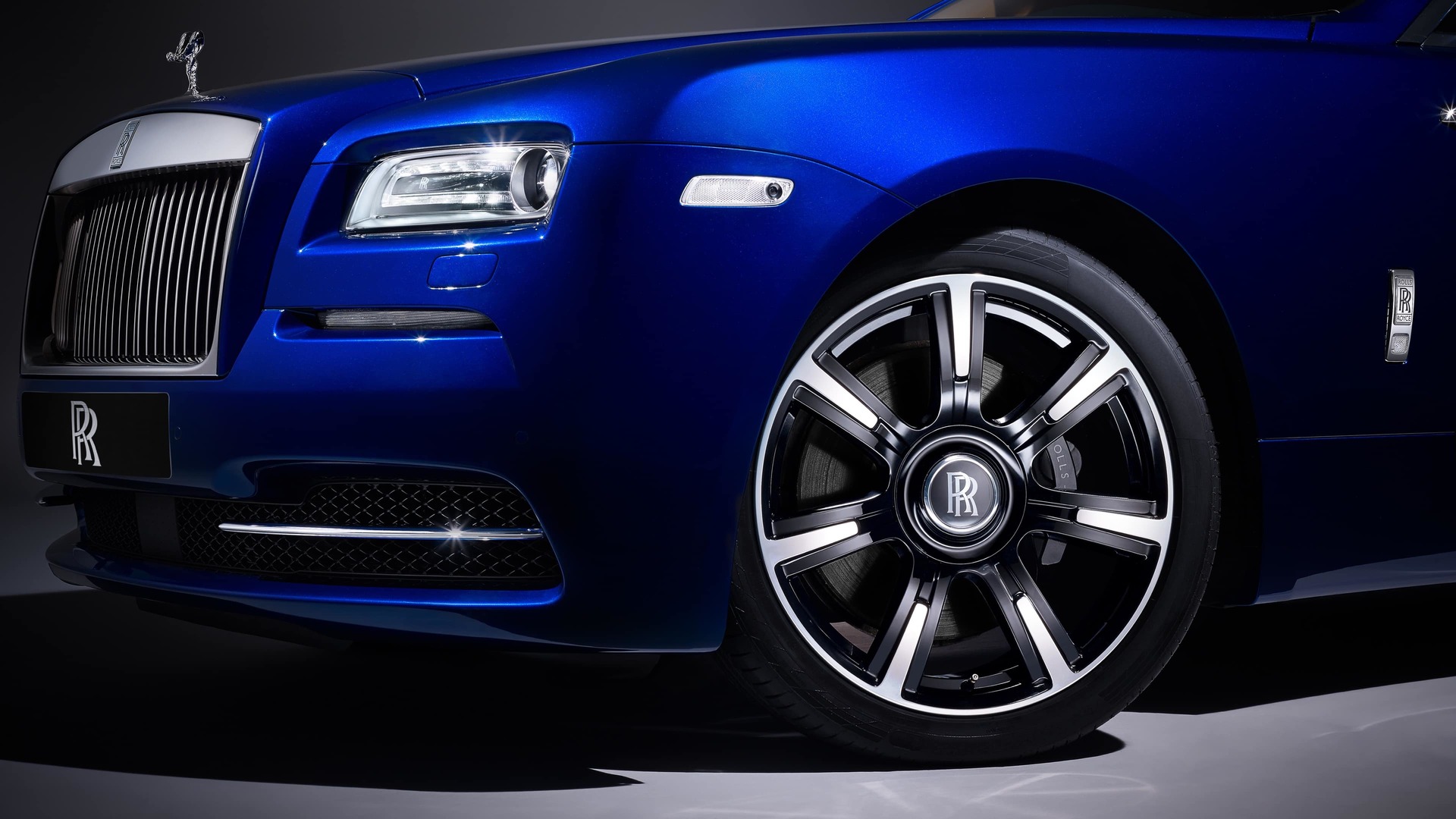A blue Rolls-Royce Motor Cars Wraith with the two-tone silver and black finish wheel style 603 - close up shot