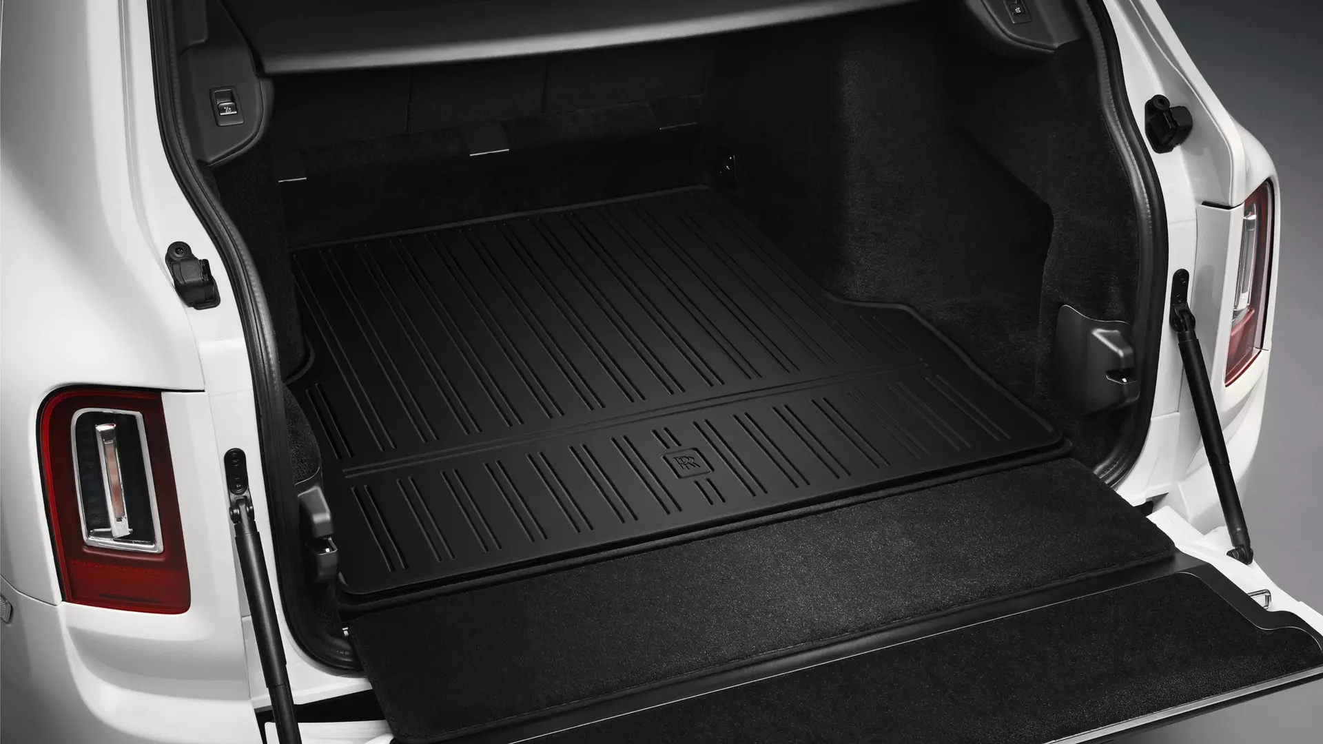 Luggage compartment of Rolls-Royce Cullinan motor car with durable, rubberised, non-slip mat