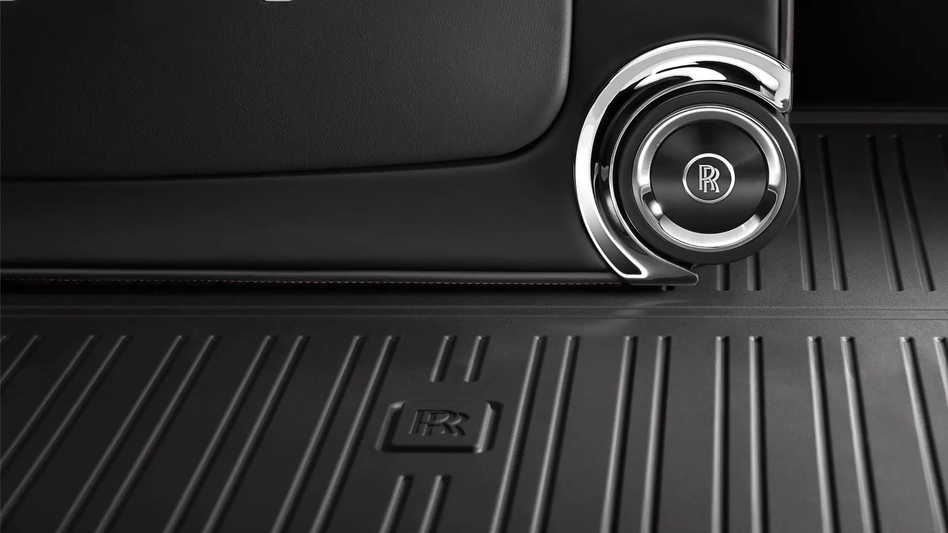 Detail of durable, rubberised, non-slip, all-weather mat for luggage compartment of Rolls-Royce motor car
