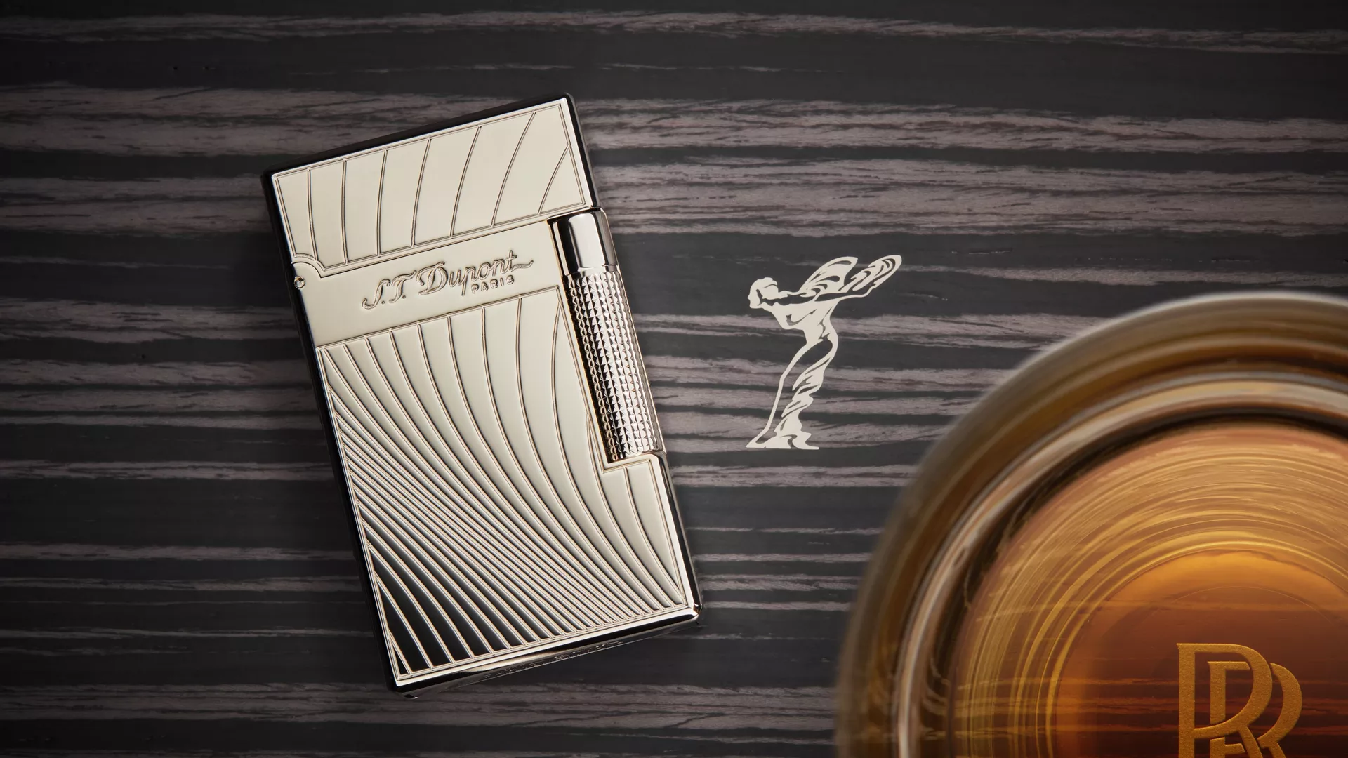 Lighter with Spirit of Ecstasy logo adjacent to it