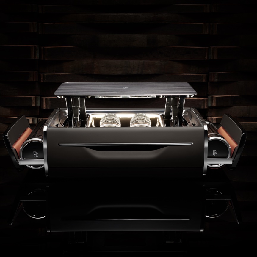 <p>Inspired by Rolls Royce’s long-established history of beautifully-designed, precision-engineered hosting equipment, the Cellarette is a humidor, drink chest and glassware storage unit. Its name pays homage to the intricately crafted wooden cabinets for storing drinks that were found in the homes of the wealthy as early as the 15th century.</p>
<p> </p>
<p>This beautiful combination of machined metal parts and handcrafted detailing presents cigars, a cutter and lighter, spirits of your choosing and crystal glasses. A snack-bowl configuration is available for non-smokers.</p>
<p> </p>
<p>At the push of a button, the humidor tray rotates, opening to present cigars. Glasses with Rolls Royce branding are offered in a similar outward rotation, and a table-top, and side hammocks with ash-tray spurs, or porcelain snack-bowls for non smokers, and a bottle-holder emerge.</p>