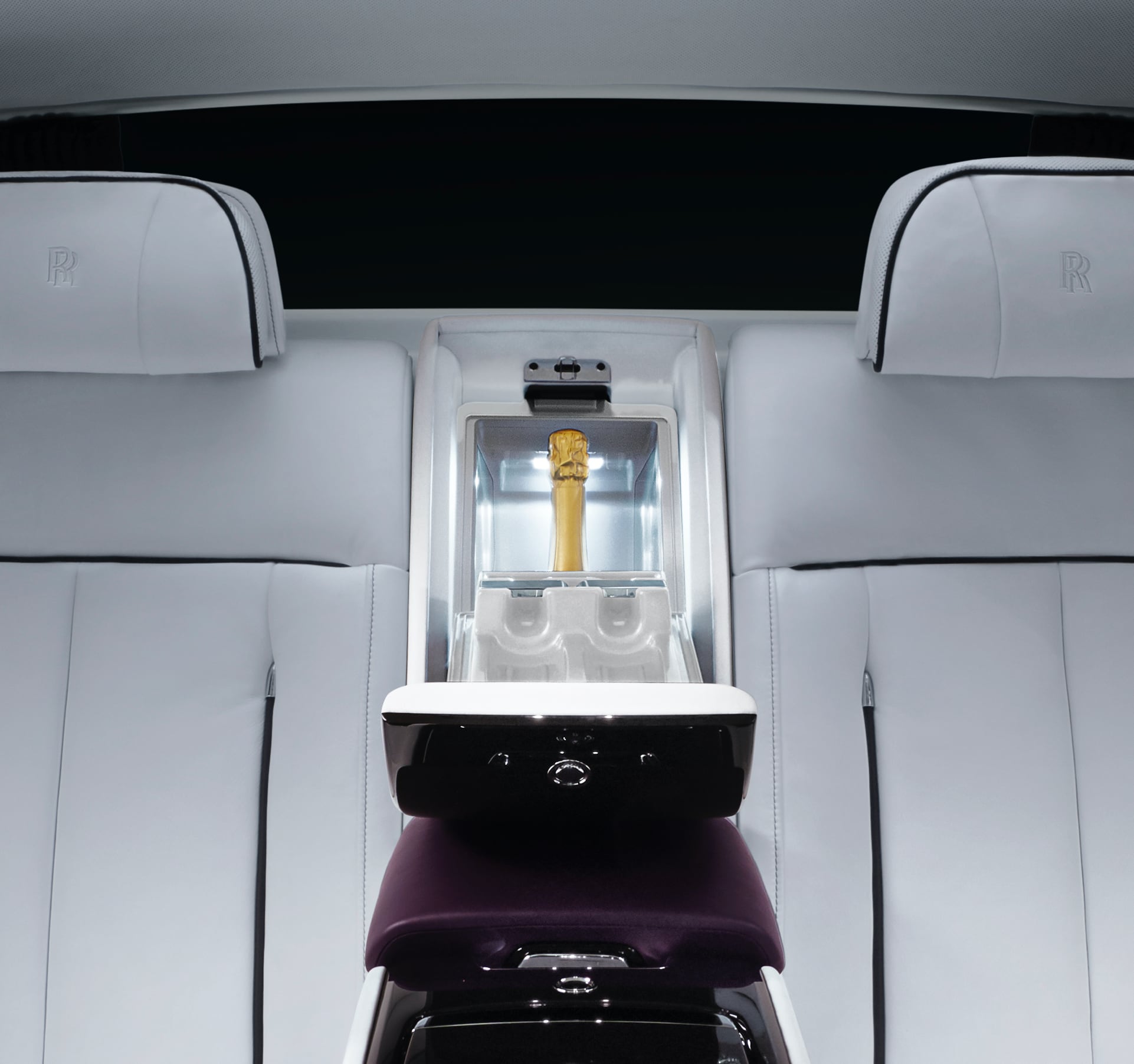 The pinnacle Rolls-Royce motor car accessory, the illuminated interior coolbox, open to reveal a bottle of Champagne