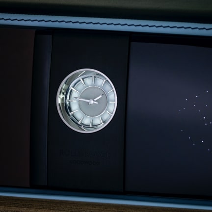<p>Three exquisite new clocks to enhance the look and feel of New Ghost. Each has its own distinct design, perfectly complimenting the interior ambiance of this motor car.</p>
<p> </p>
<p>‘Dynamic’ Enhanced Clock</p>
<p>With a focus on purity of materials and simple graphical execution, the Dynamic Enhanced Clock is a true modernist statement. </p>
<p>A chamfered surface is complemented with precision milled hour markers, with each quarter-hour illuminated for stunning emphasis.</p>
<p> </p>
<p>‘Indulge’ Enhanced Clock</p>
<p>A jewel-like focal point, the Indulge Enhanced clock evokes the world of high-end luxury timepieces. </p>
<p>Three dimensional polished aluminium chaplets and illuminated inserts denote a design with a beating heart of contemporary romance. </p>
<p> </p>
<p>‘Technical’ Enhanced Clock</p>
<p>The precision engineering heritage of our founder Sir Henry Royce is the inspiration behind the design of this clock. </p>
<p>The central dial appears to float, allowing a subtle, diffused light to glow from behind, while the hands are meticulously machined from stainless steel. </p>