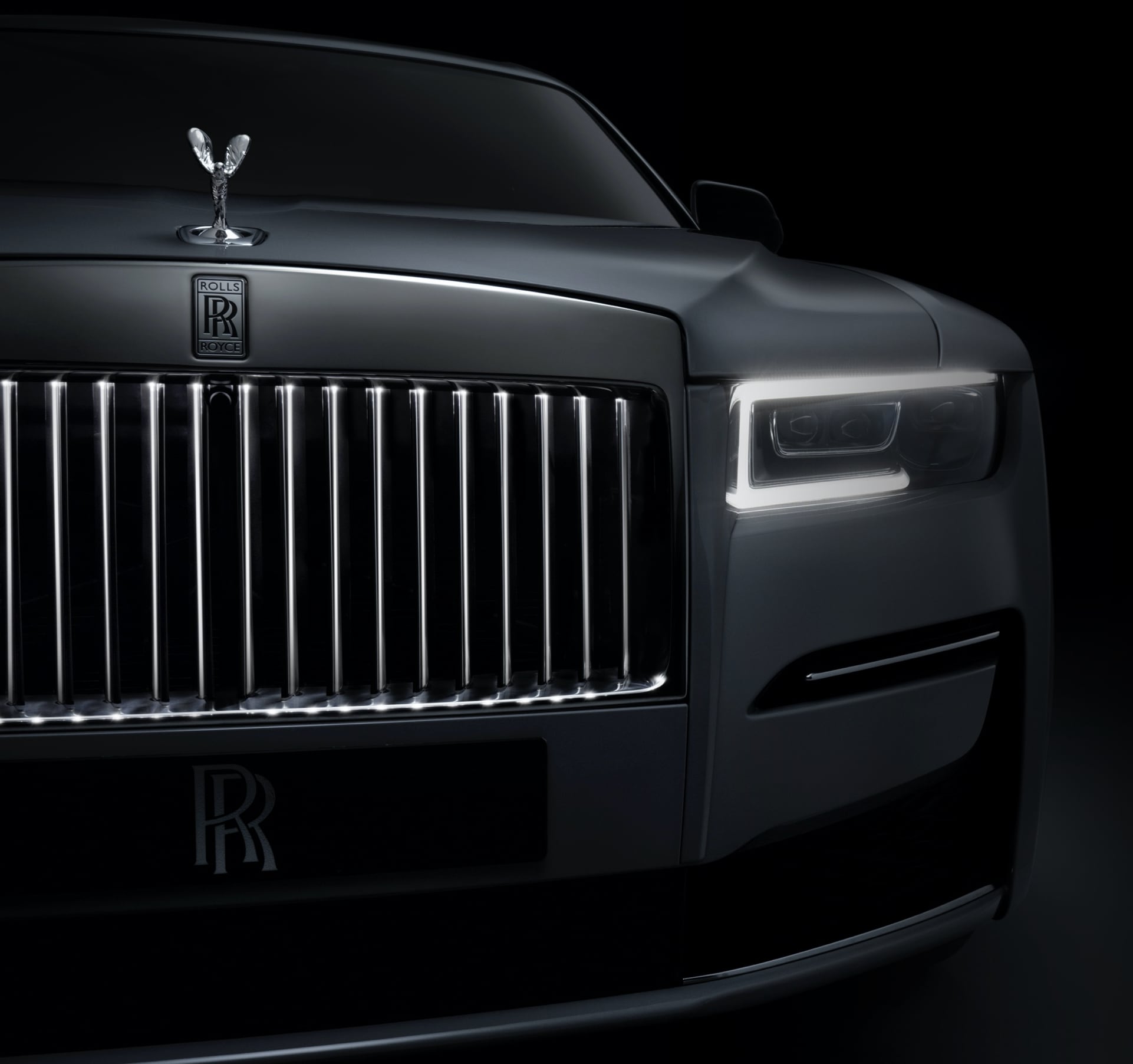 Close front view of Rolls-Royce motor car's illuminated grille