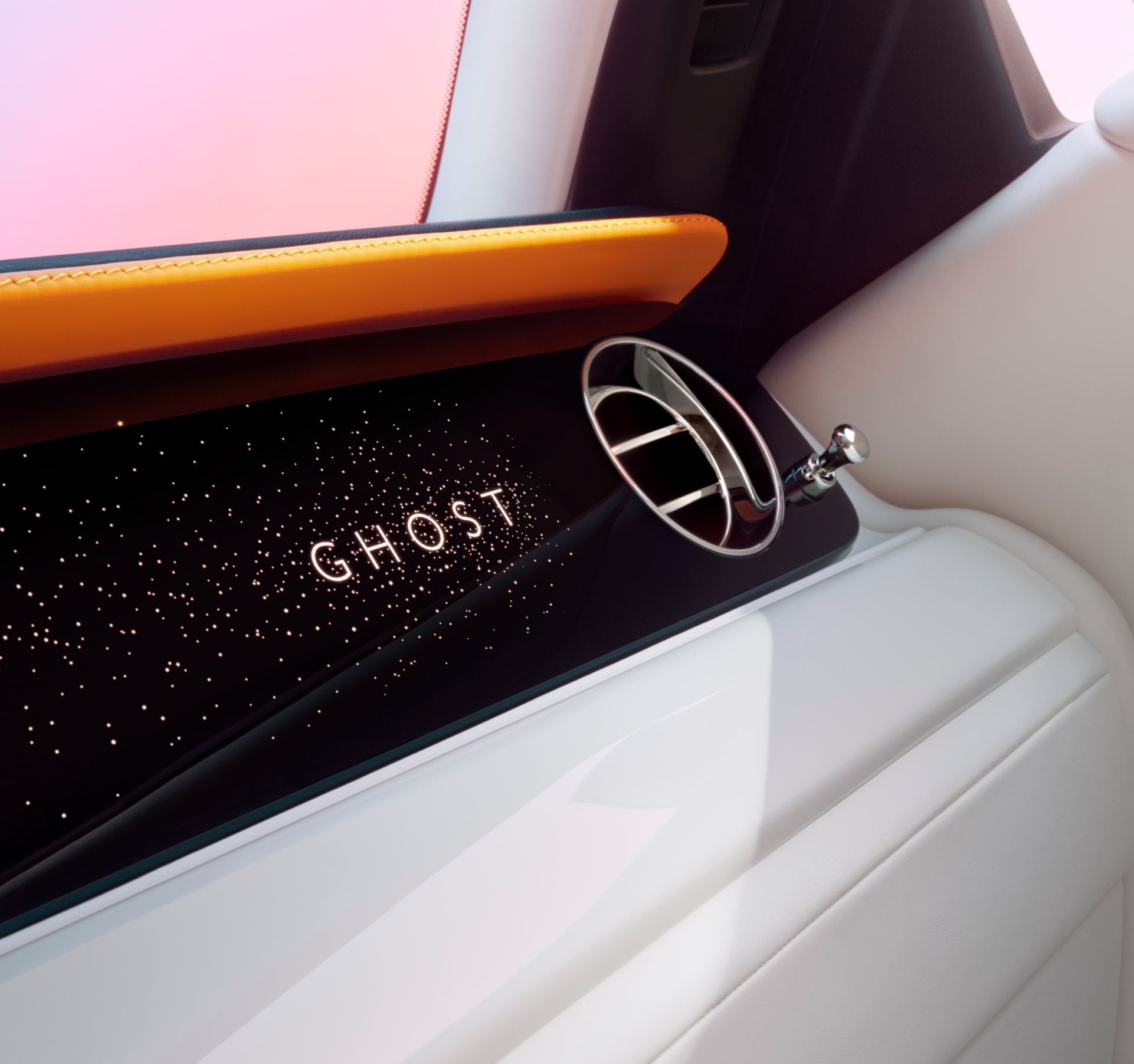 Detailed view of the illuminated fascia with the lettering "Ghost" on it