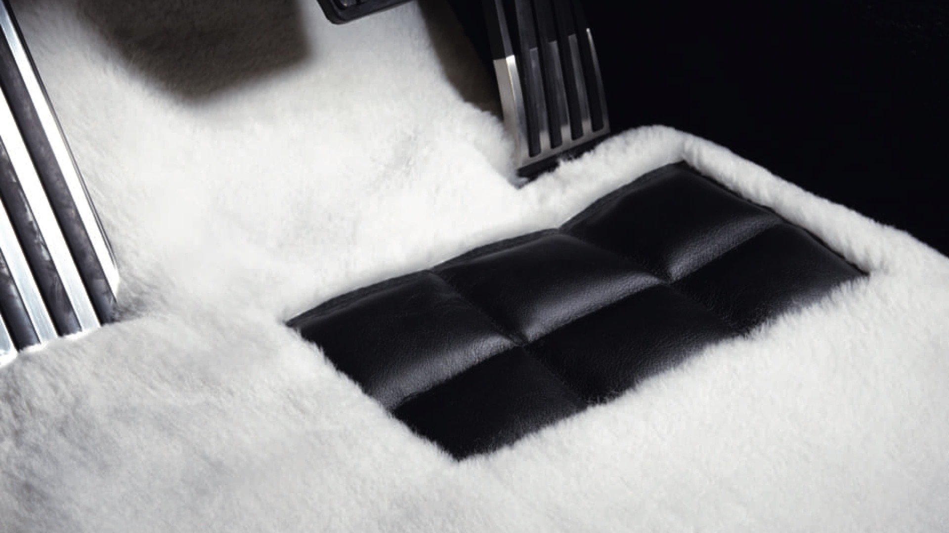 Tailor-made Rolls-Royce lambswool floor mat in white by driver's pedals