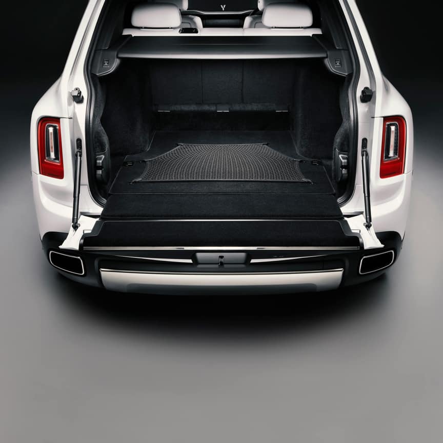 Rolls-Royce Cullinan motor car with rear door open revealing durable luggage net