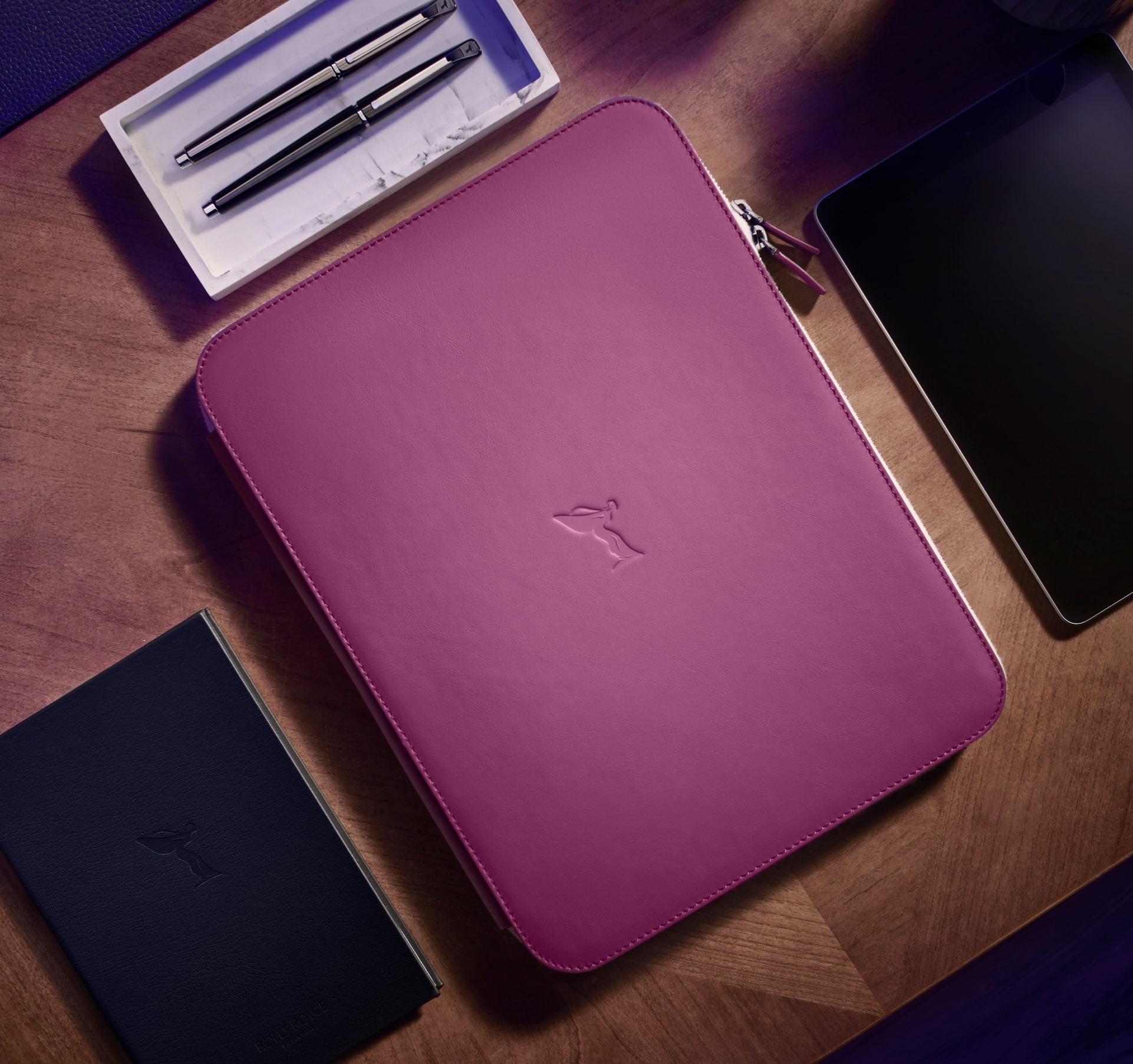 A photo of a Rolls-Royce Natural Grain Leather organiser pouch in Tailored Purple