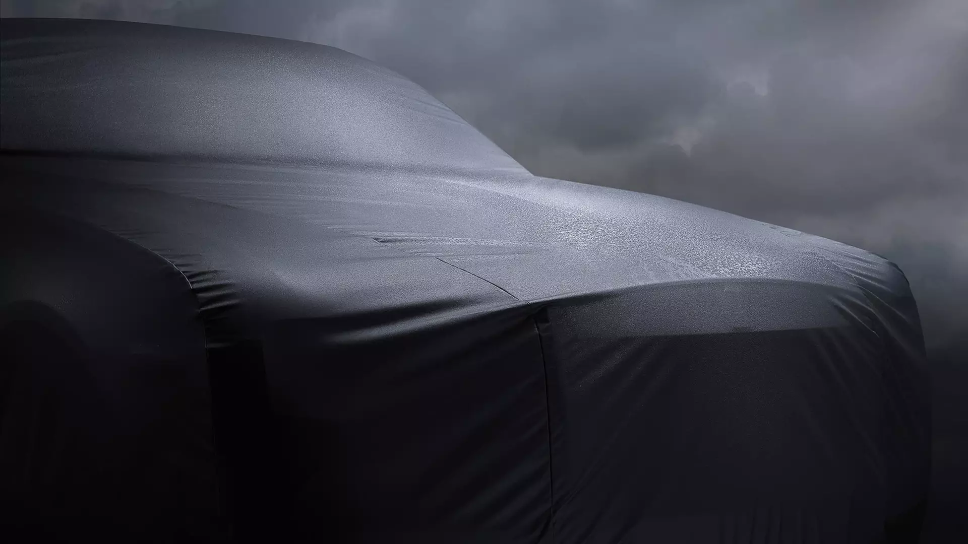 Close-up of Rolls-Royce outdoor car cover on Rolls-Royce motor car