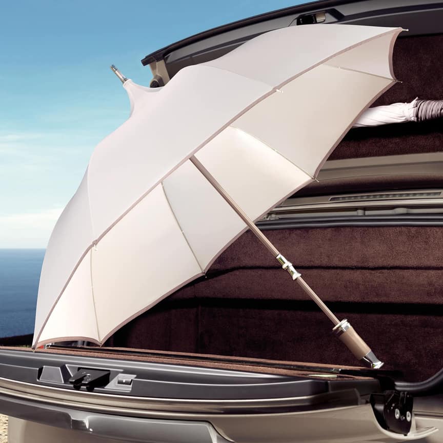 <p>Comprising an ivory cotton twill canopy with contrasting taupe edging, these beautifully hand-crafted parasols protect you from the sun whilst offering a touch of elegance to any occasion.</p>